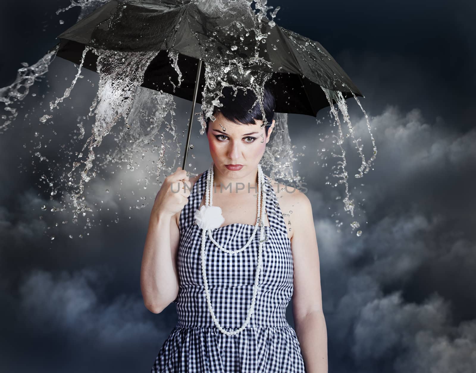 woman with black umbrella in heavy rain