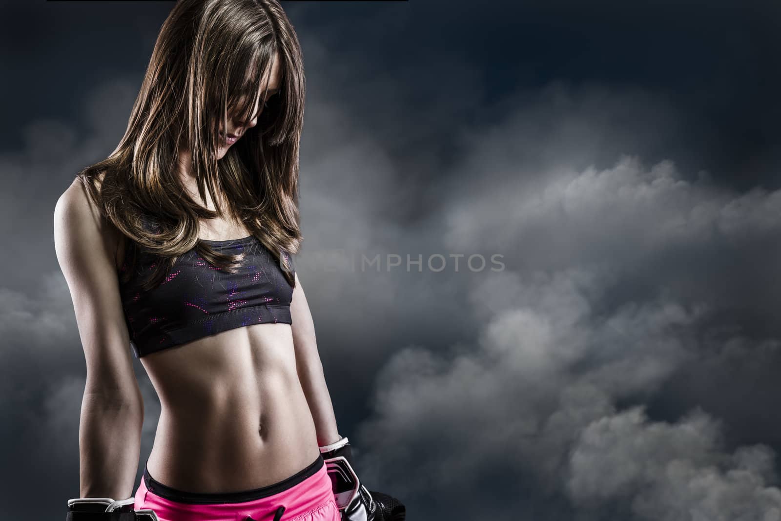 beautiful woman athlete on Cloud Background, fitness