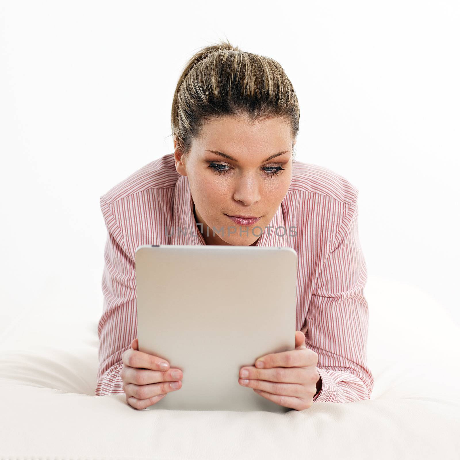 beautiful woman on sofa with tablet