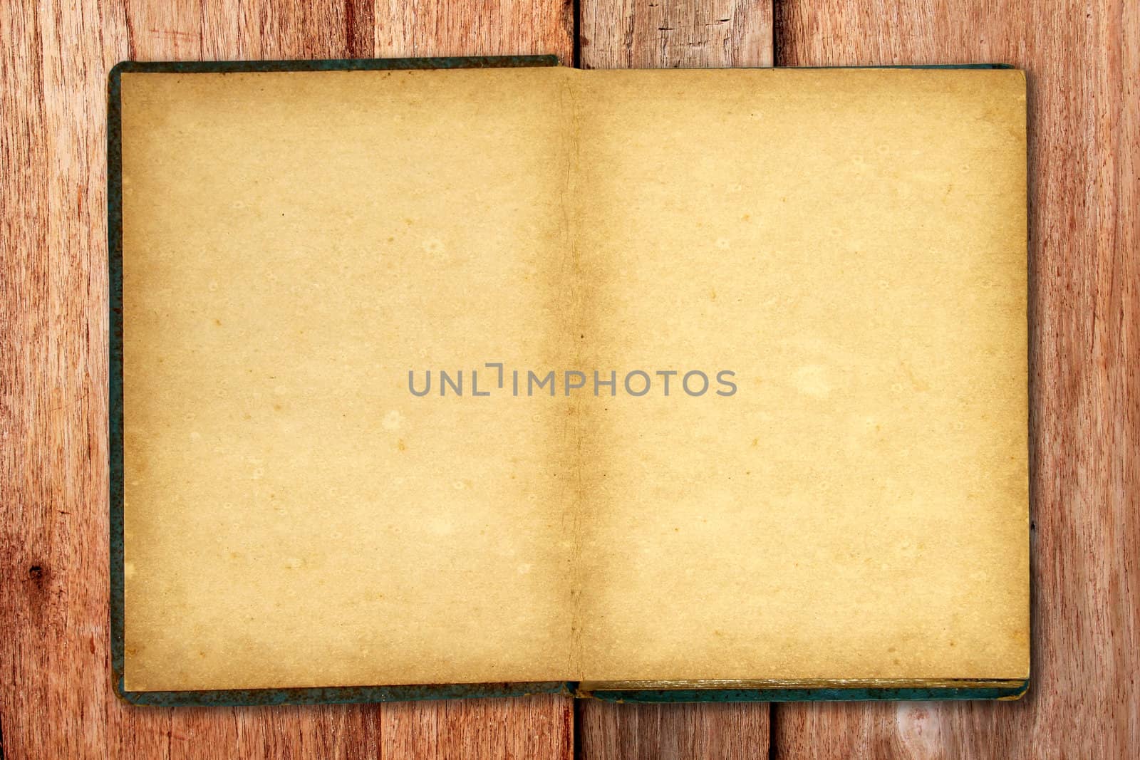 Old blank open notebook on wooden background