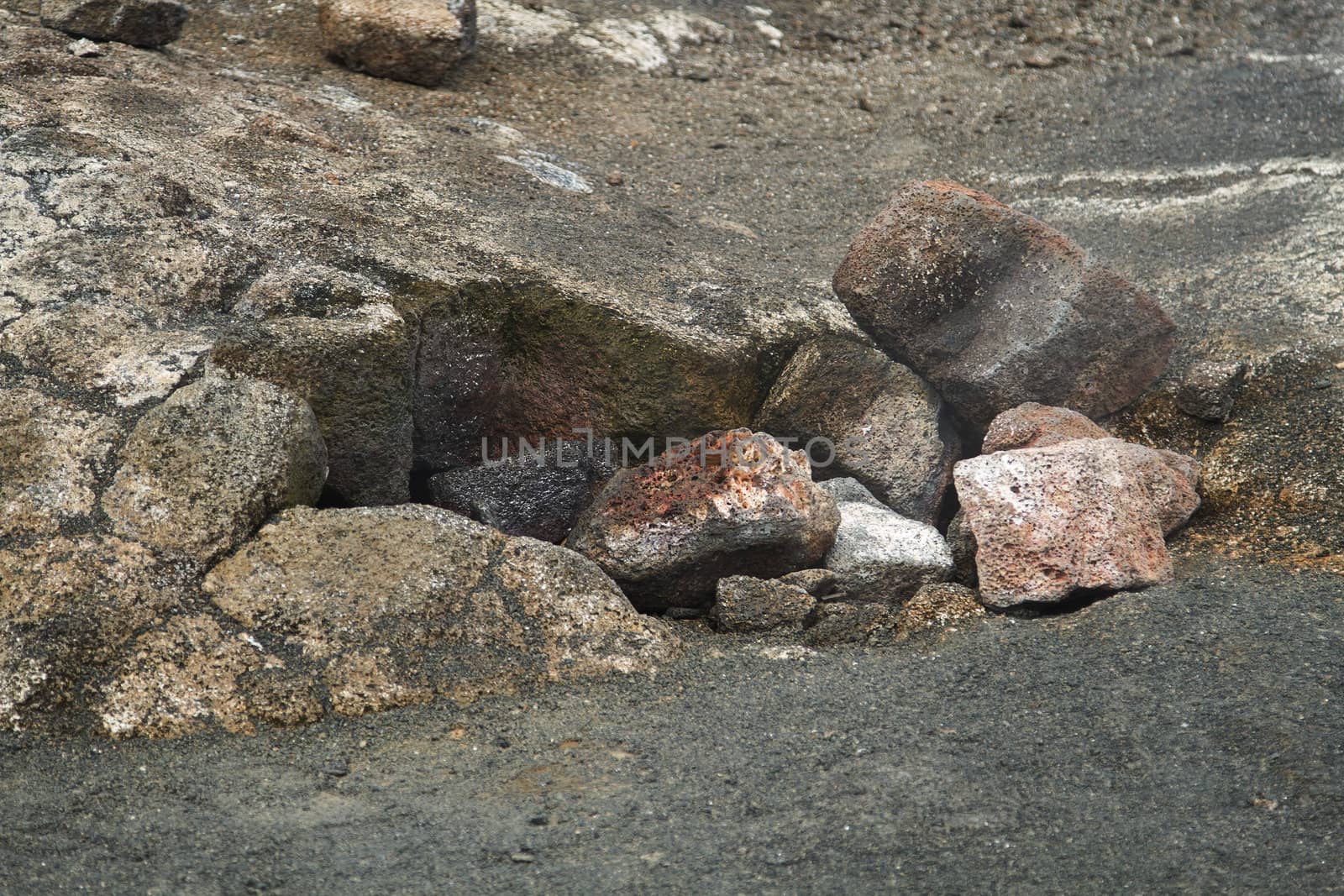 Steam escaping from a hole covered by rocks in the kilauea crater
