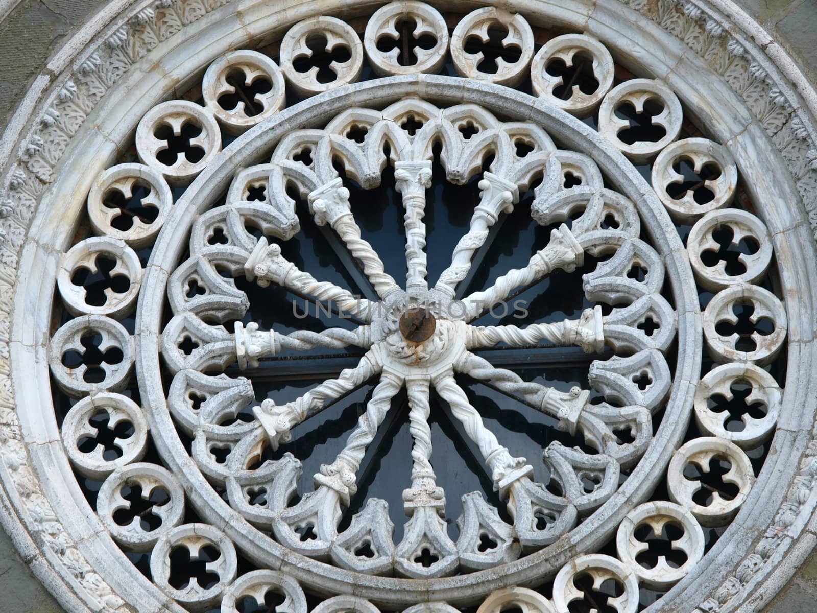 Rose window on the facade of the church of St. Margaret of Cortona