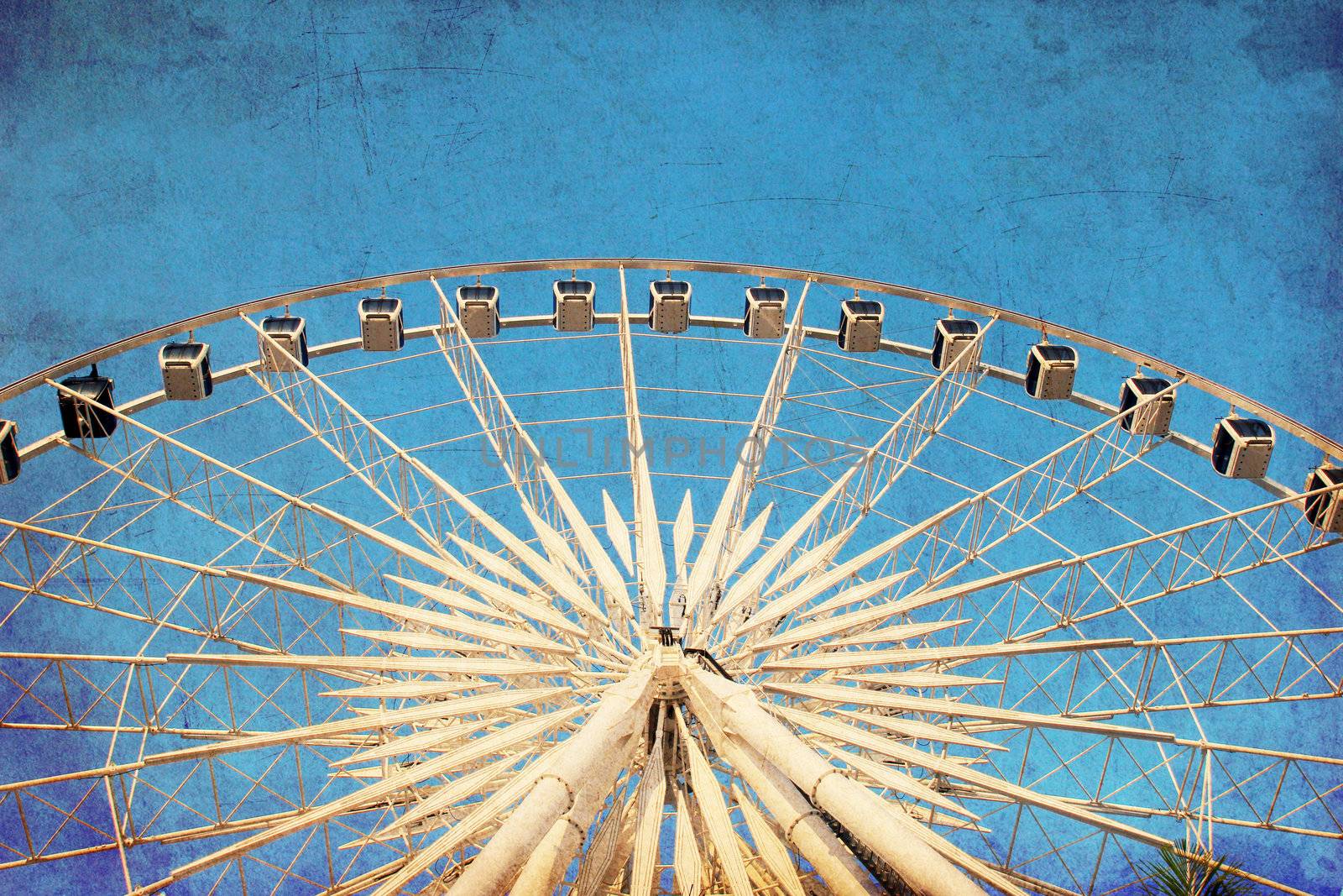 Ferris wheel with blue sky, photo in old image style