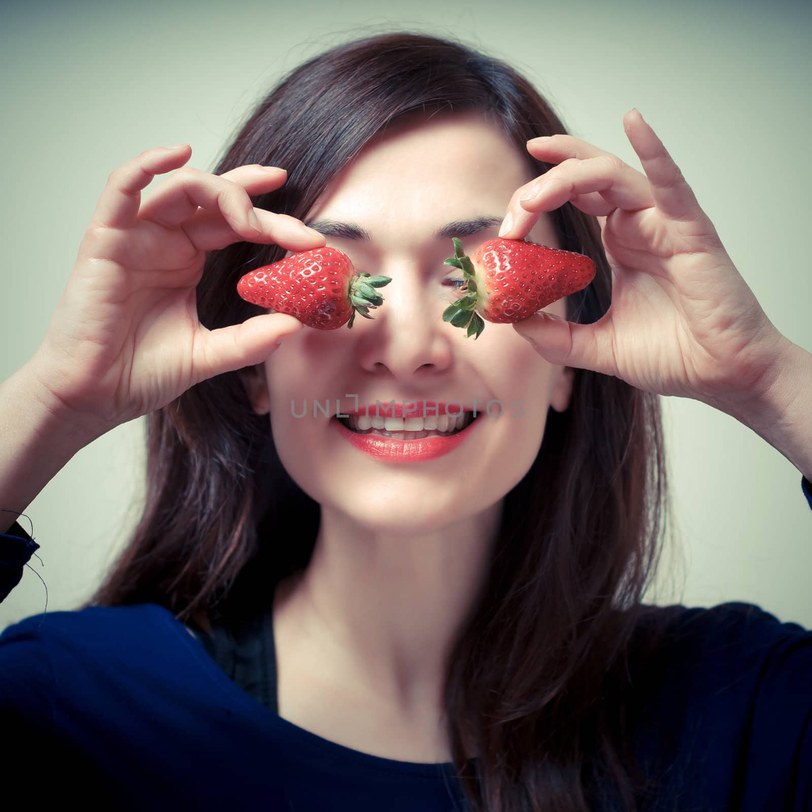 beautiful woman with strawberries on eyes by peus