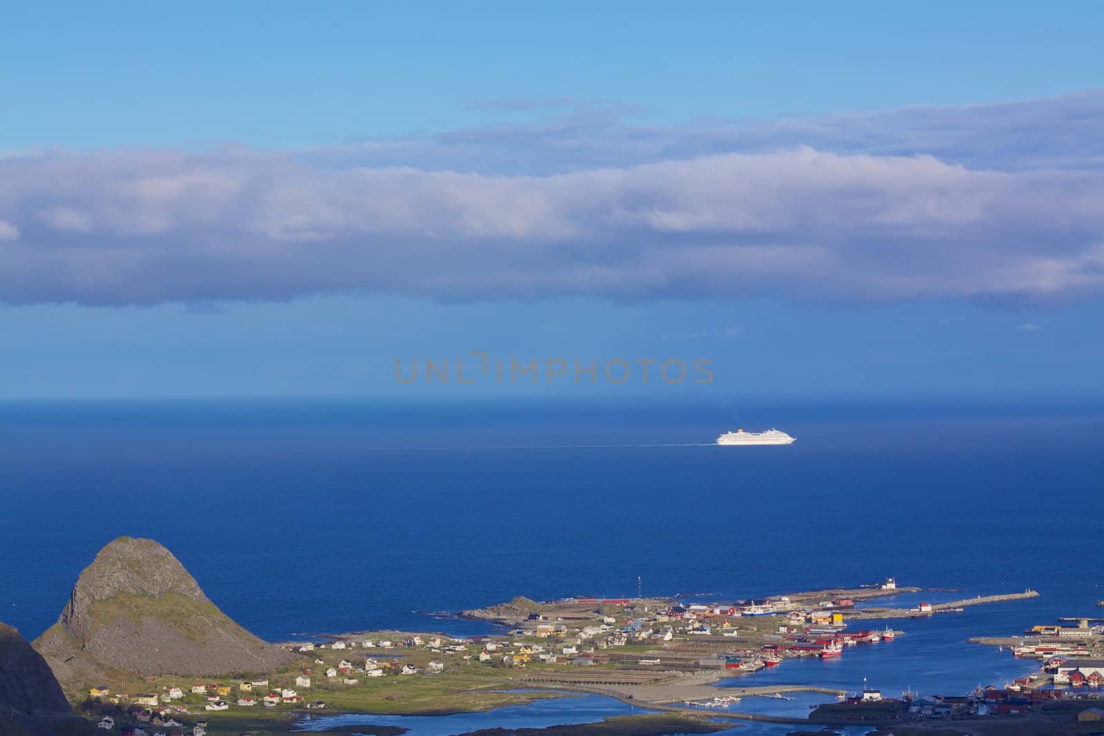 Luxurious ocean cruiser sailing along picturesque norwegian coast on sunny summer day