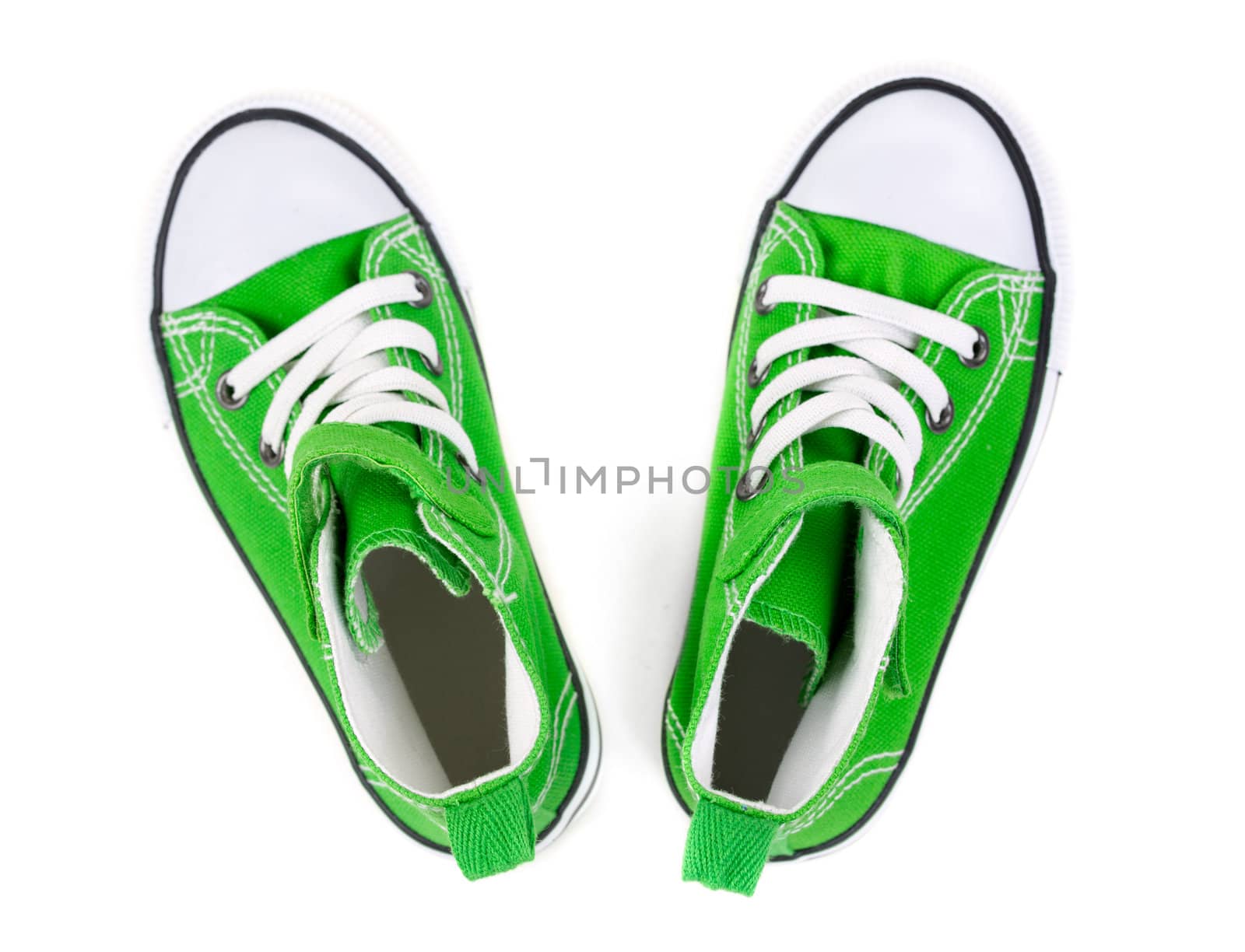 Green sneakers on a white background. Top view
