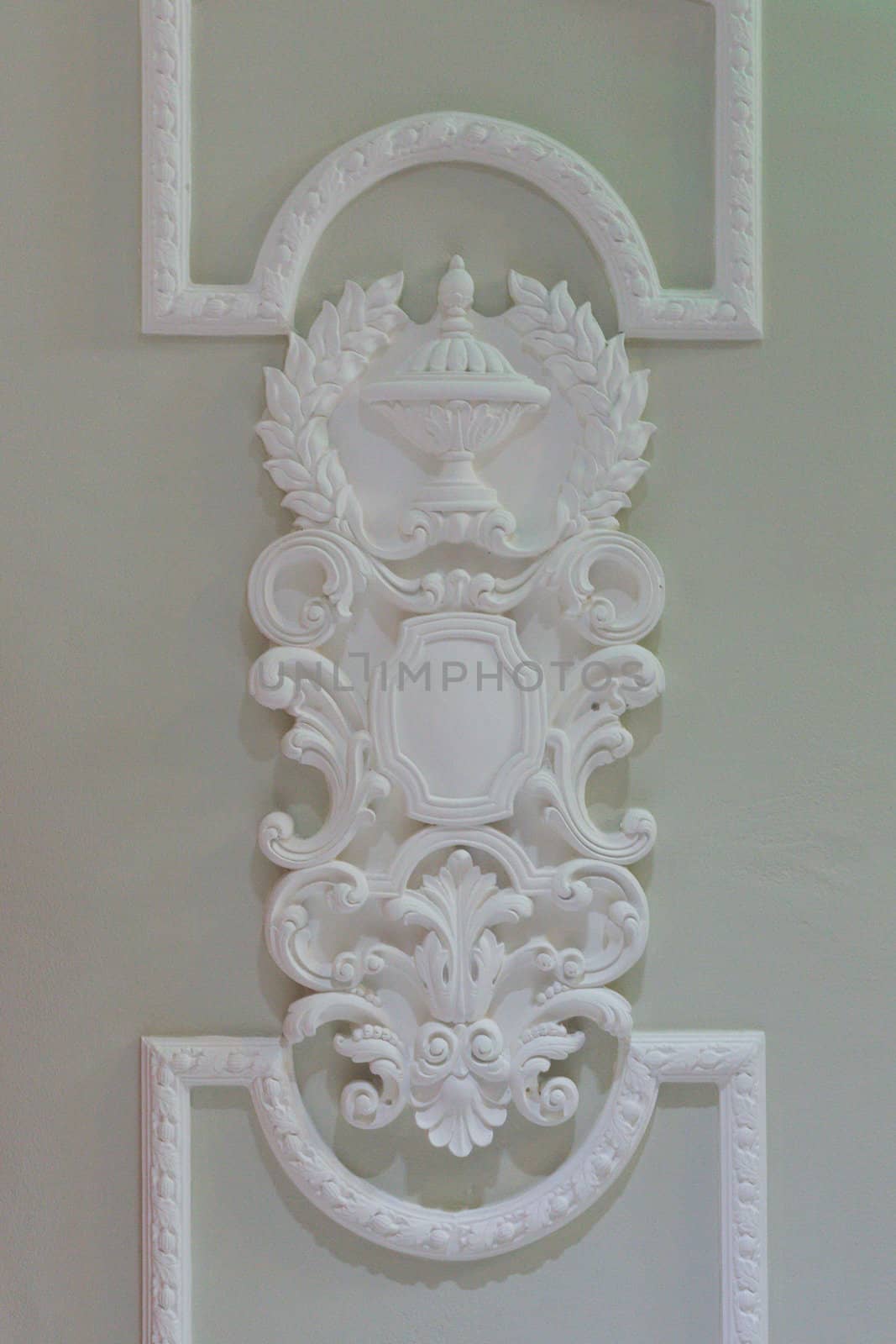 decorative moldings on the white wall