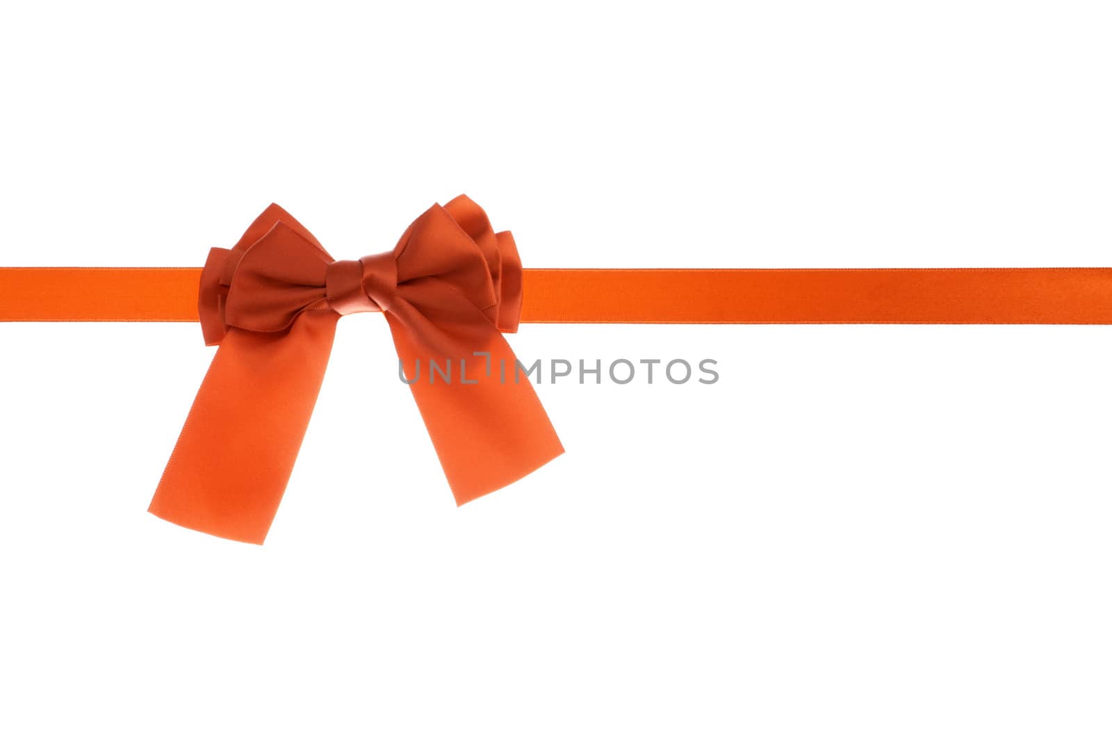 Holiday concept red ribbon bow isolated on white background.
