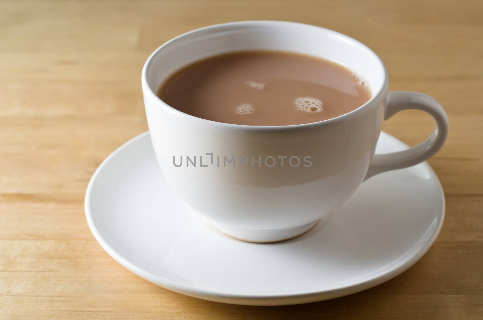 Tea Cup and Saucer on Table by frannyanne