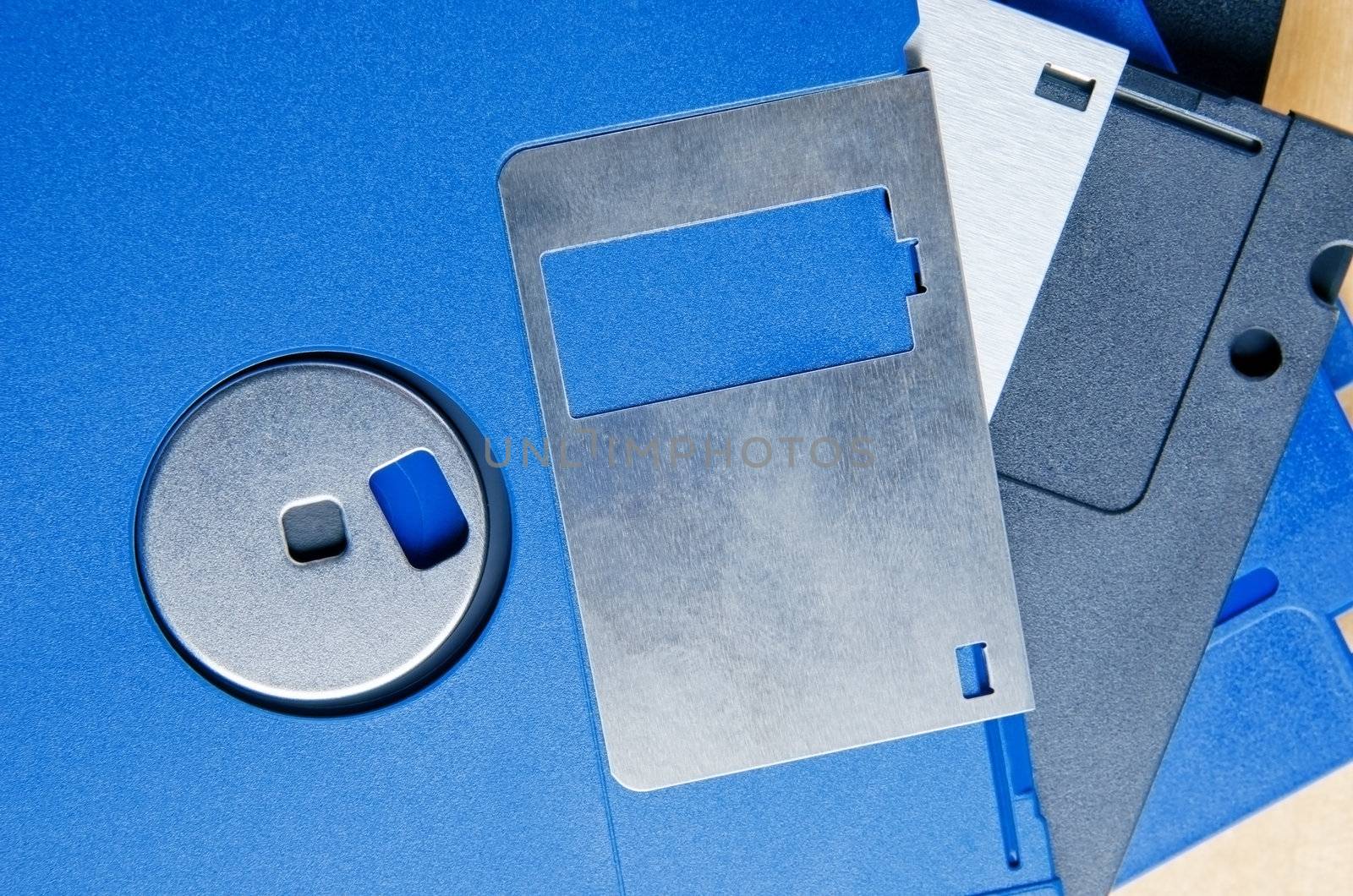 Close up (macro) of a pile of old three and a quarter inch floppy disks to illustrate media storage and/or old technologies.