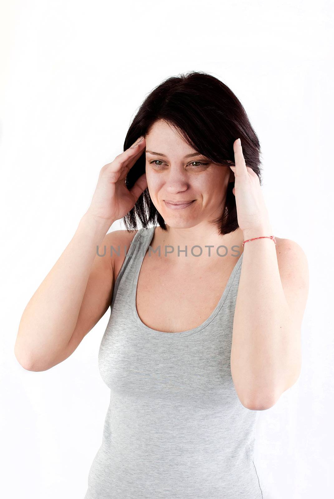 young woman with headache making massage to avoid pain