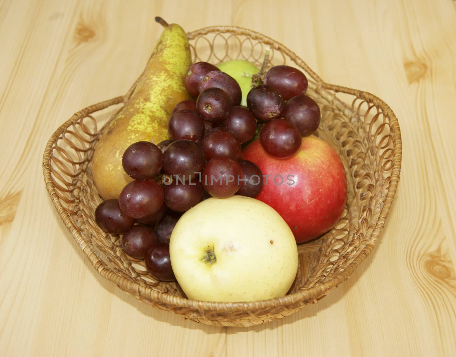 Fruits on table in basket by cobol1964