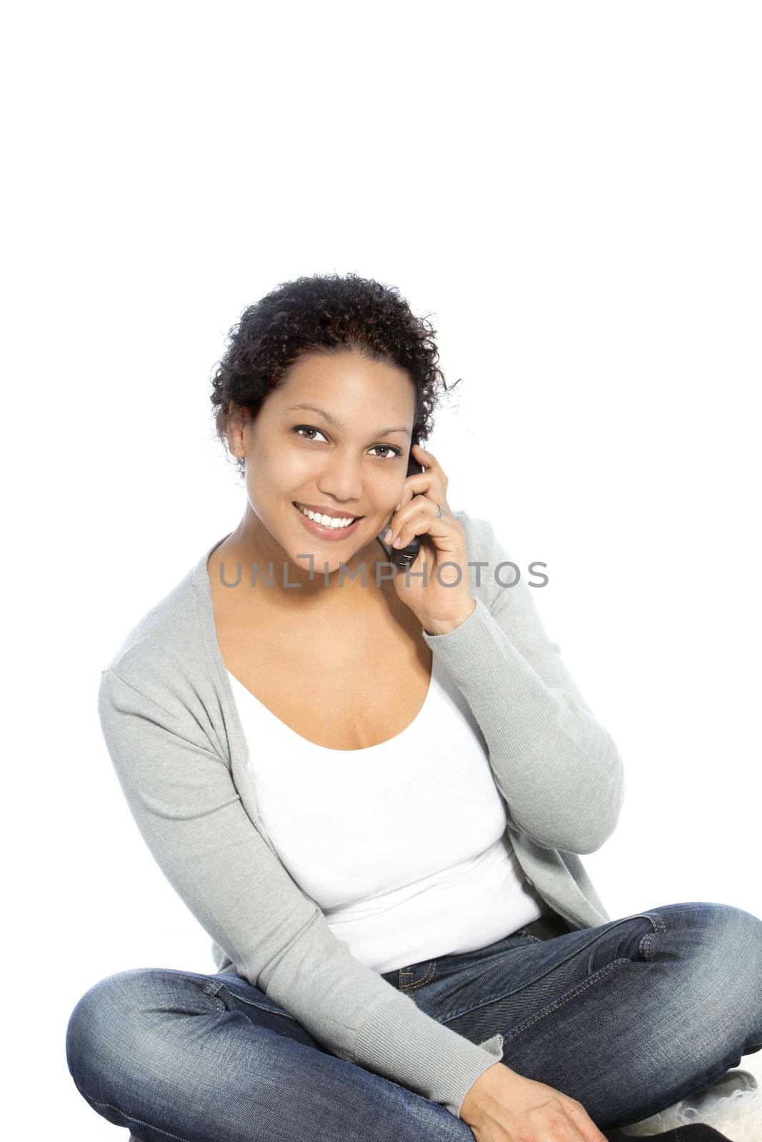 Smiling African American woman calling via cellular phone