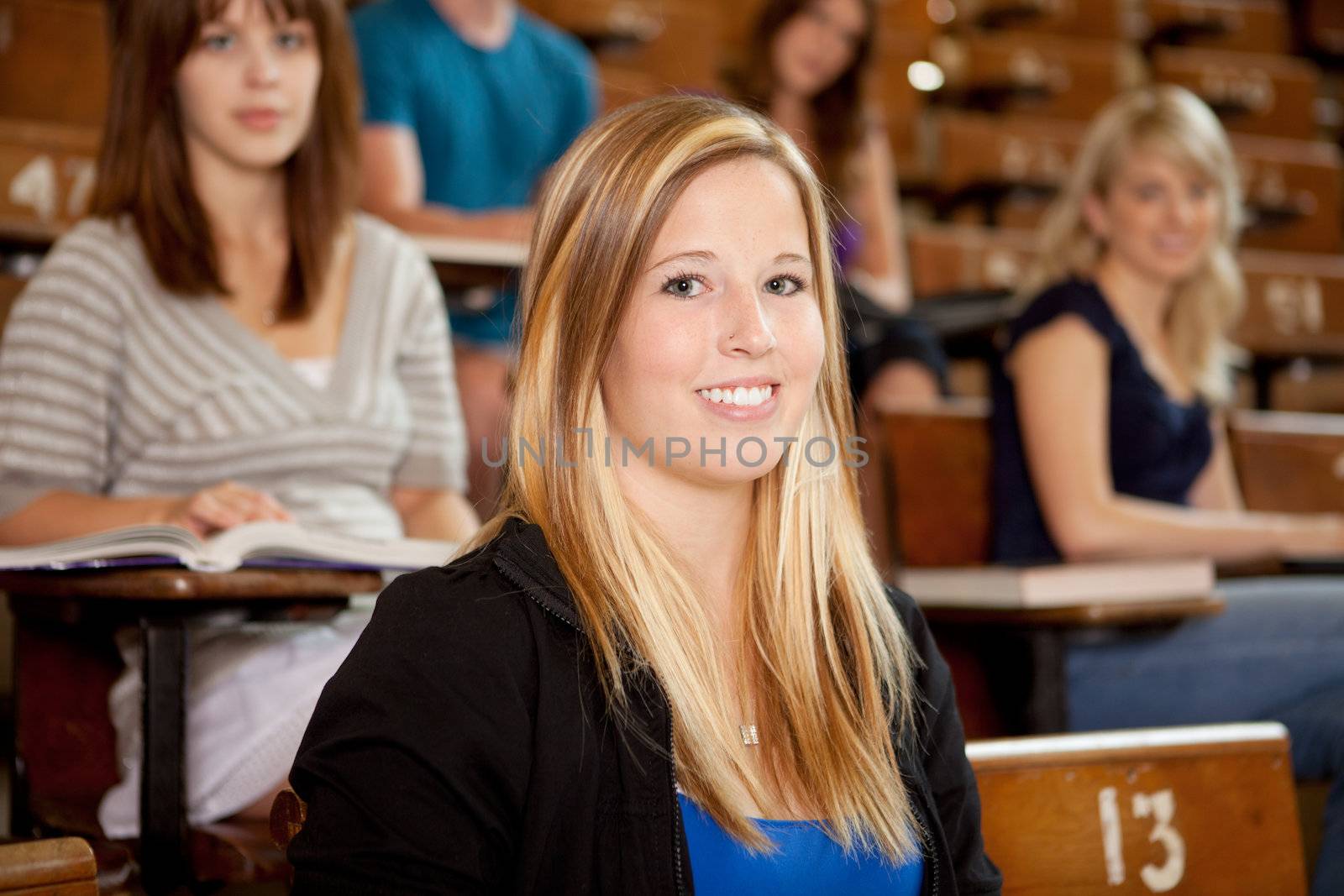Smiling Student in Class by leaf
