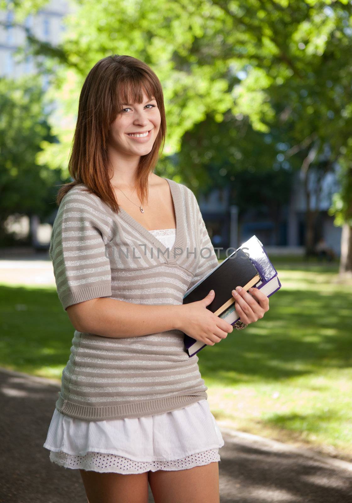 Happy university student looking at the camera