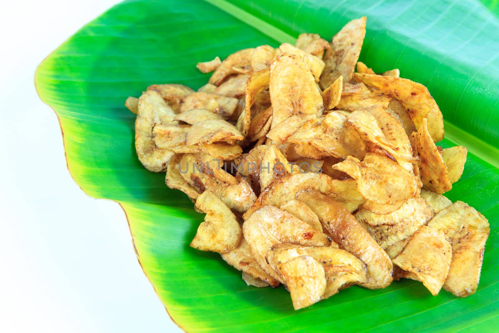 banana glazed with sugar on banana leaf