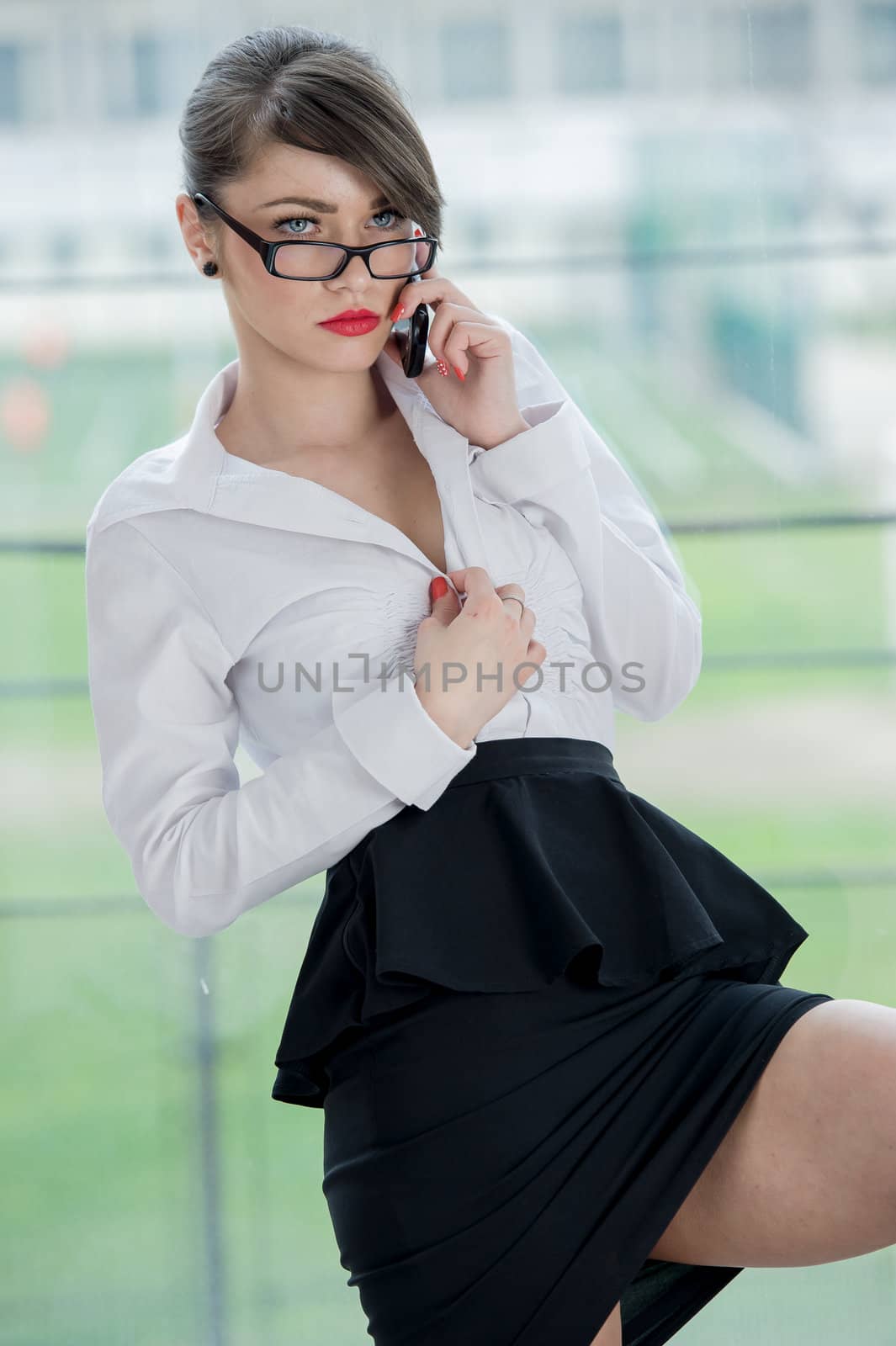 beautiful bussines woman with laptop and phone