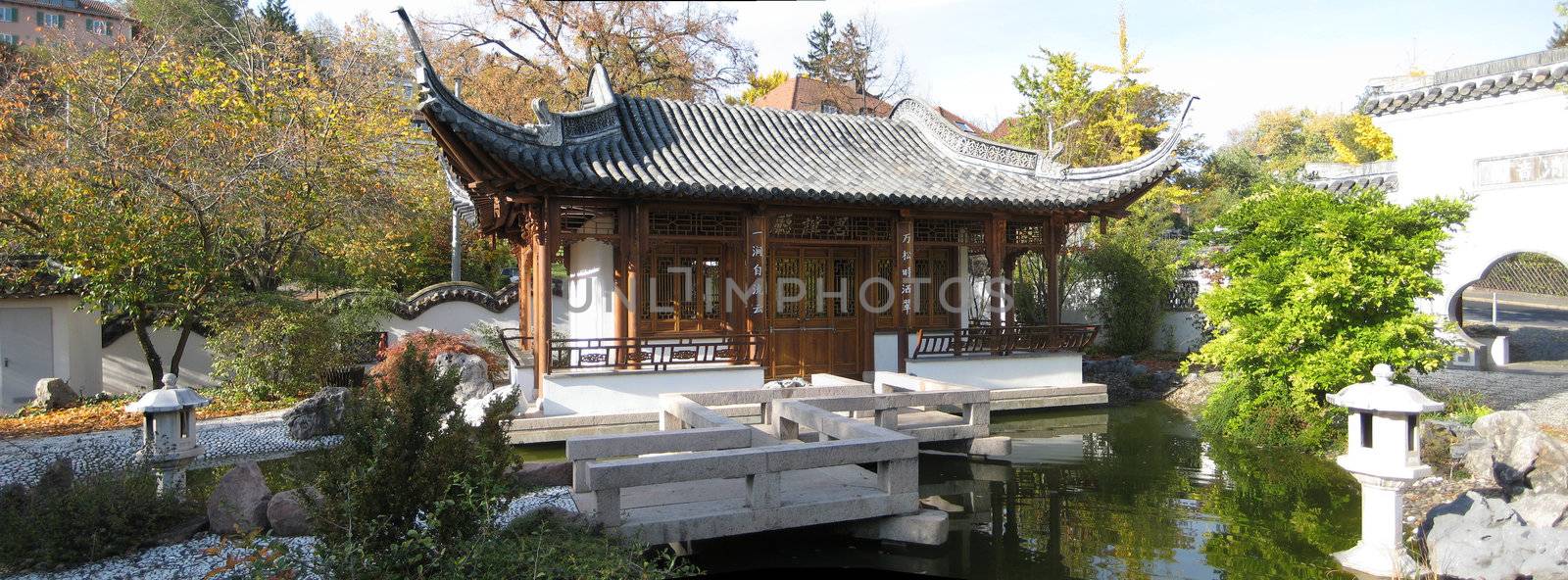 panorama scene of a typical chinese garden with tempel house
