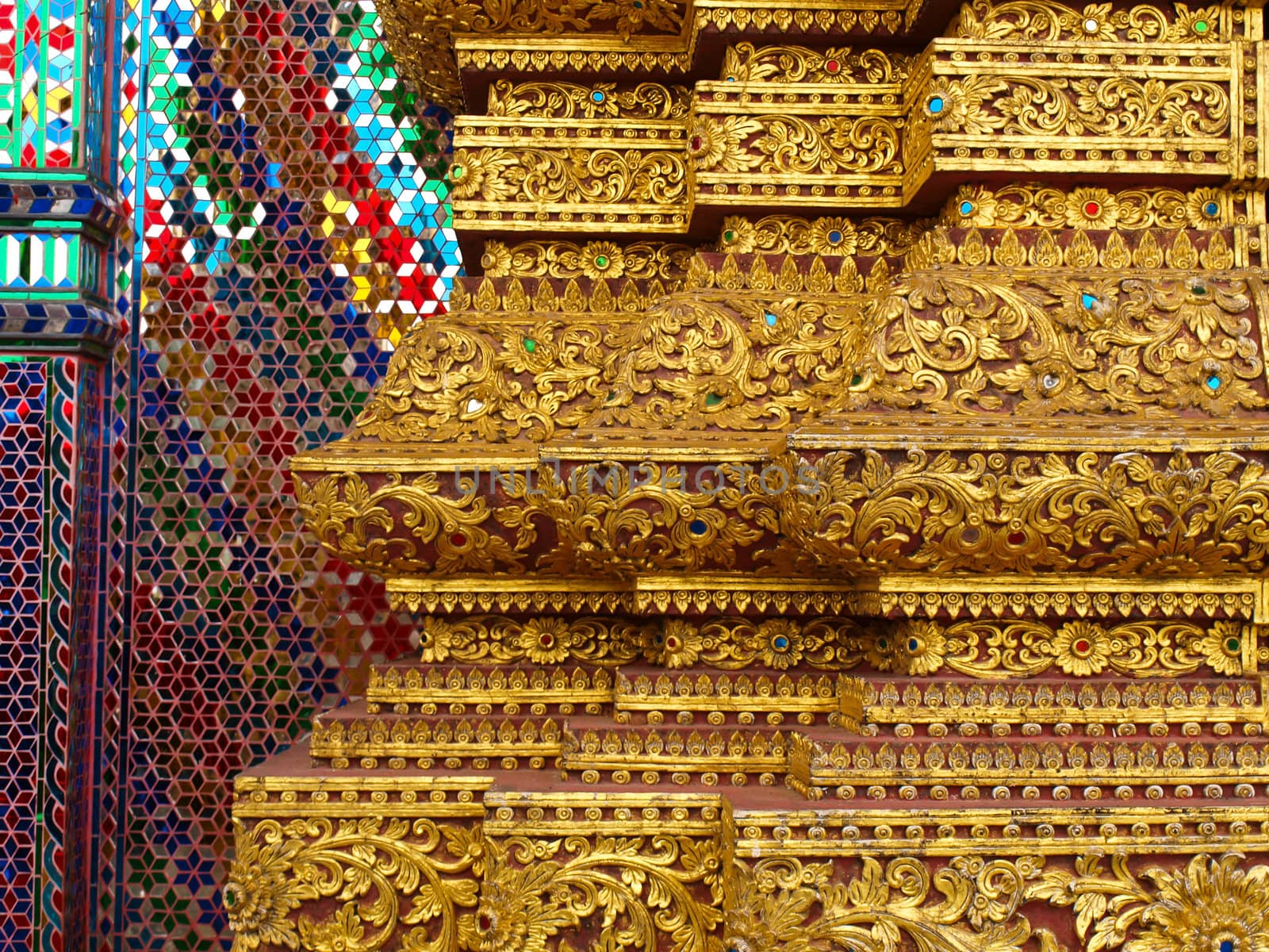 Golden engraved stucco decoration in Buddhist vihara in Thailand