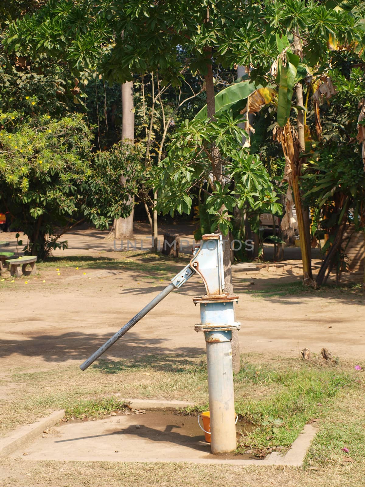Old rusty groundwater pump by gururugu