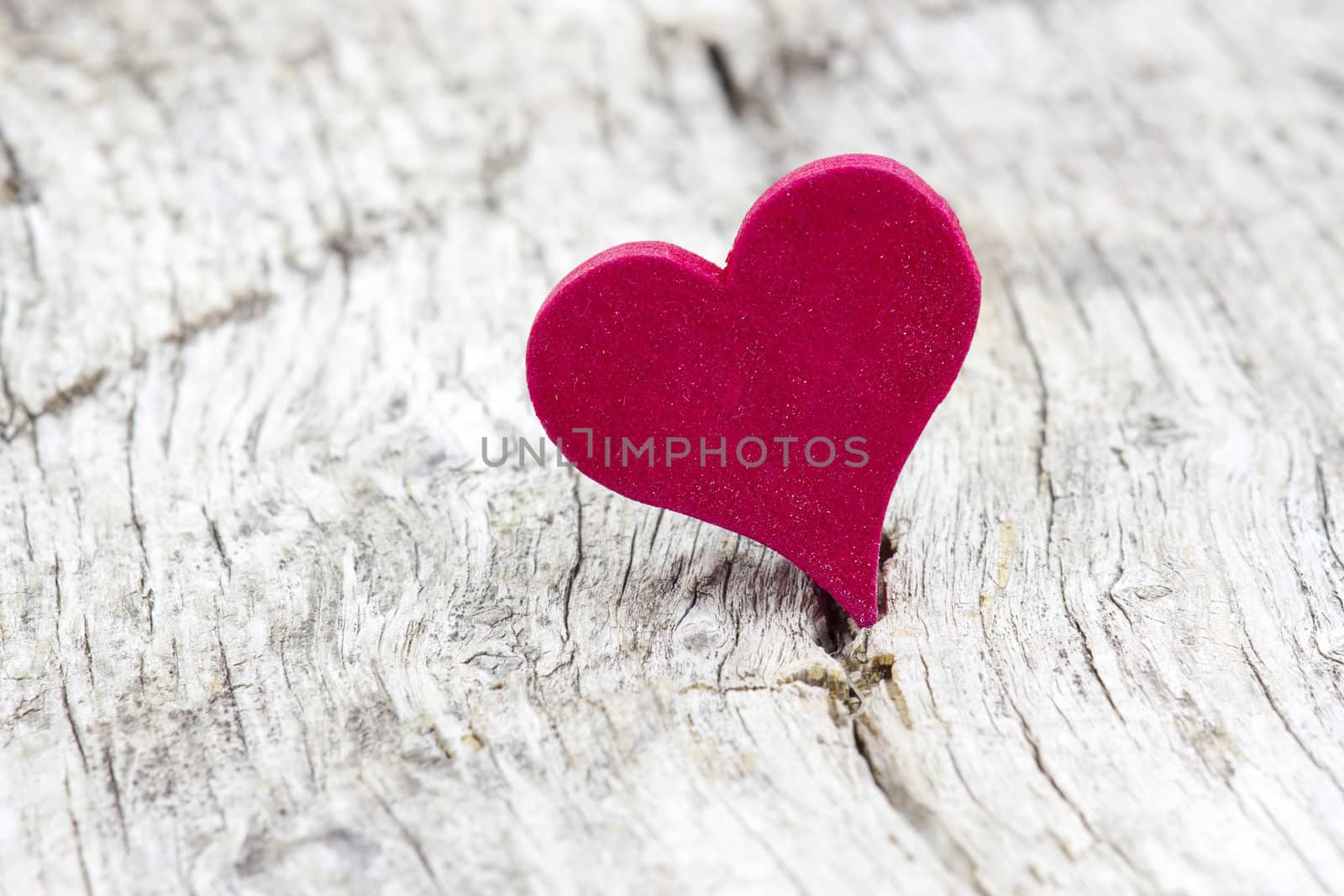 red heart on wooden background