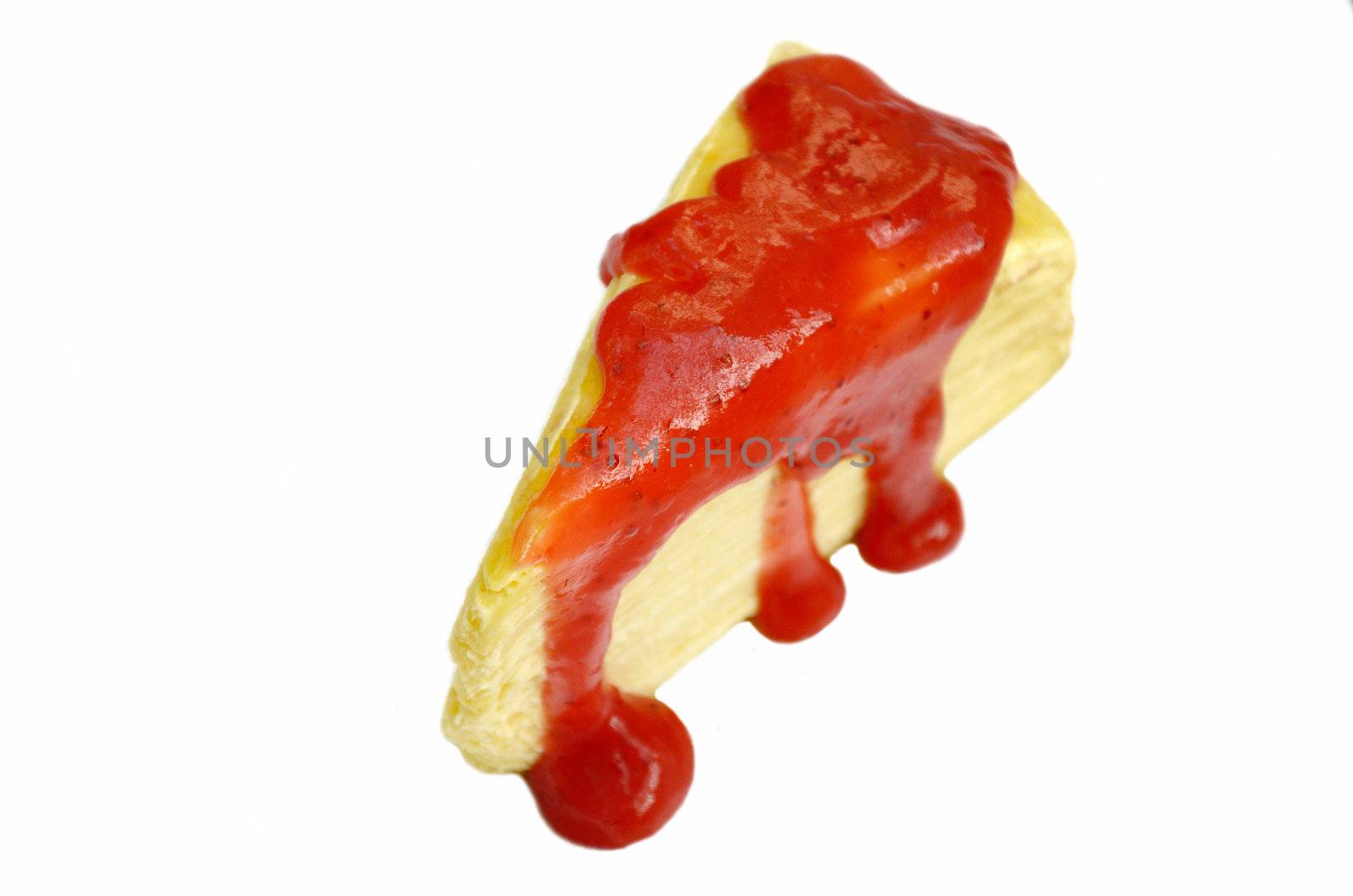 Crape cake with strawberry sauce on white background