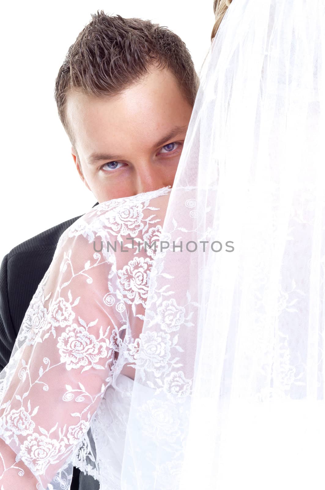 Groom looking over her wife's shoulder