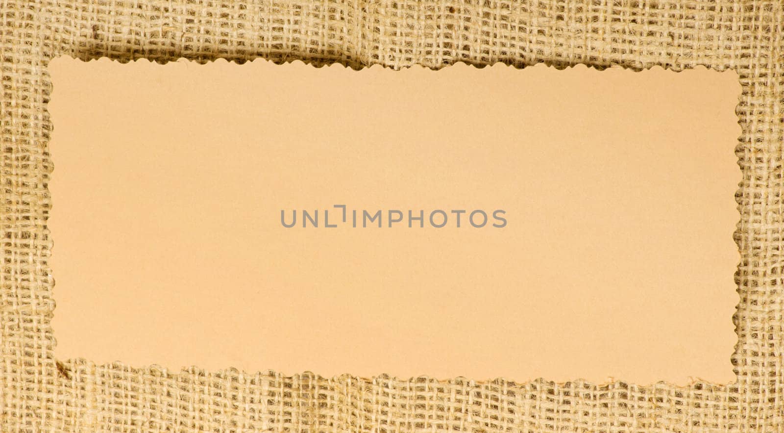 Old paper tag on natural burlap