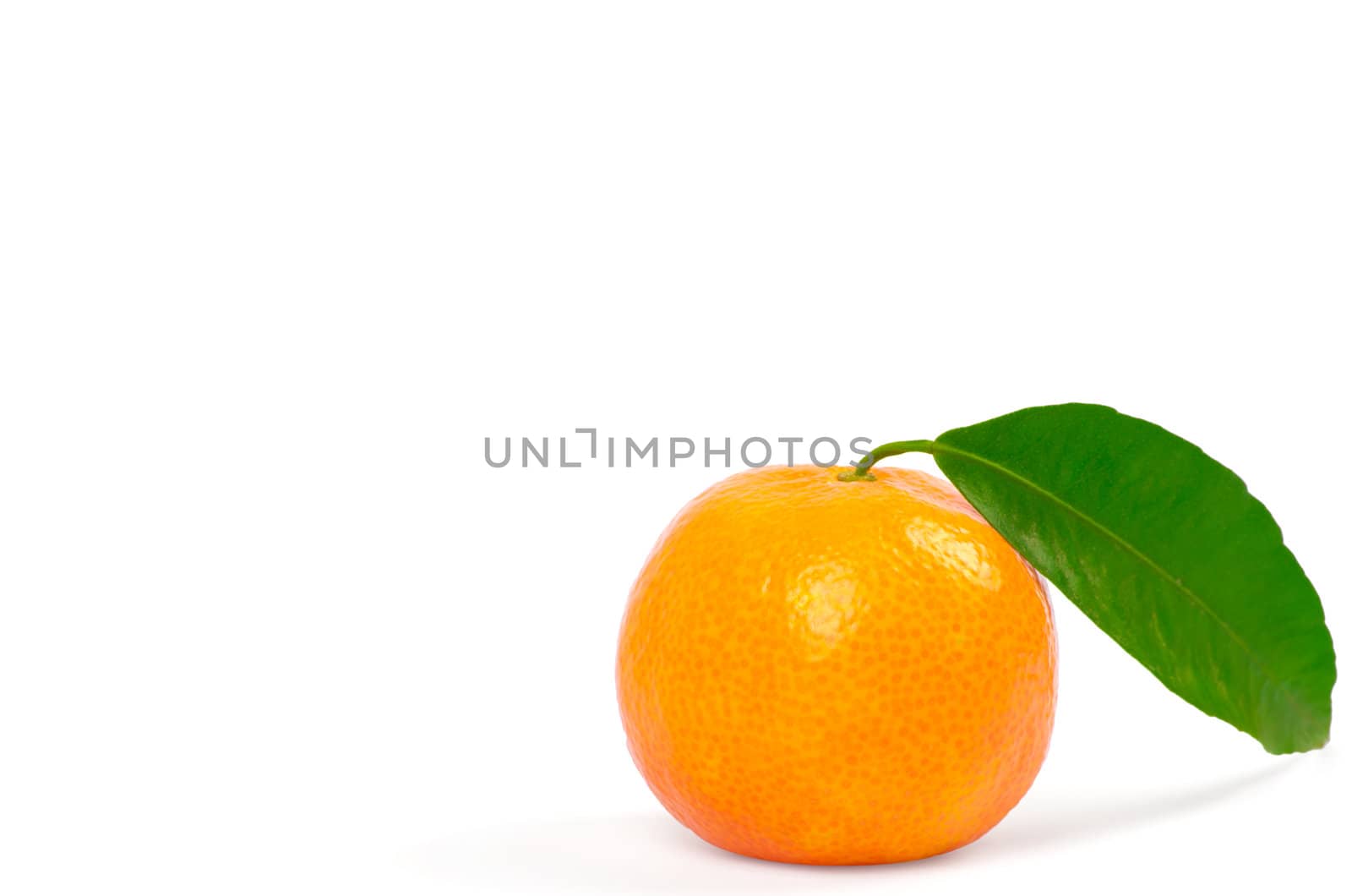 Tangerine with green leaves isolated on white