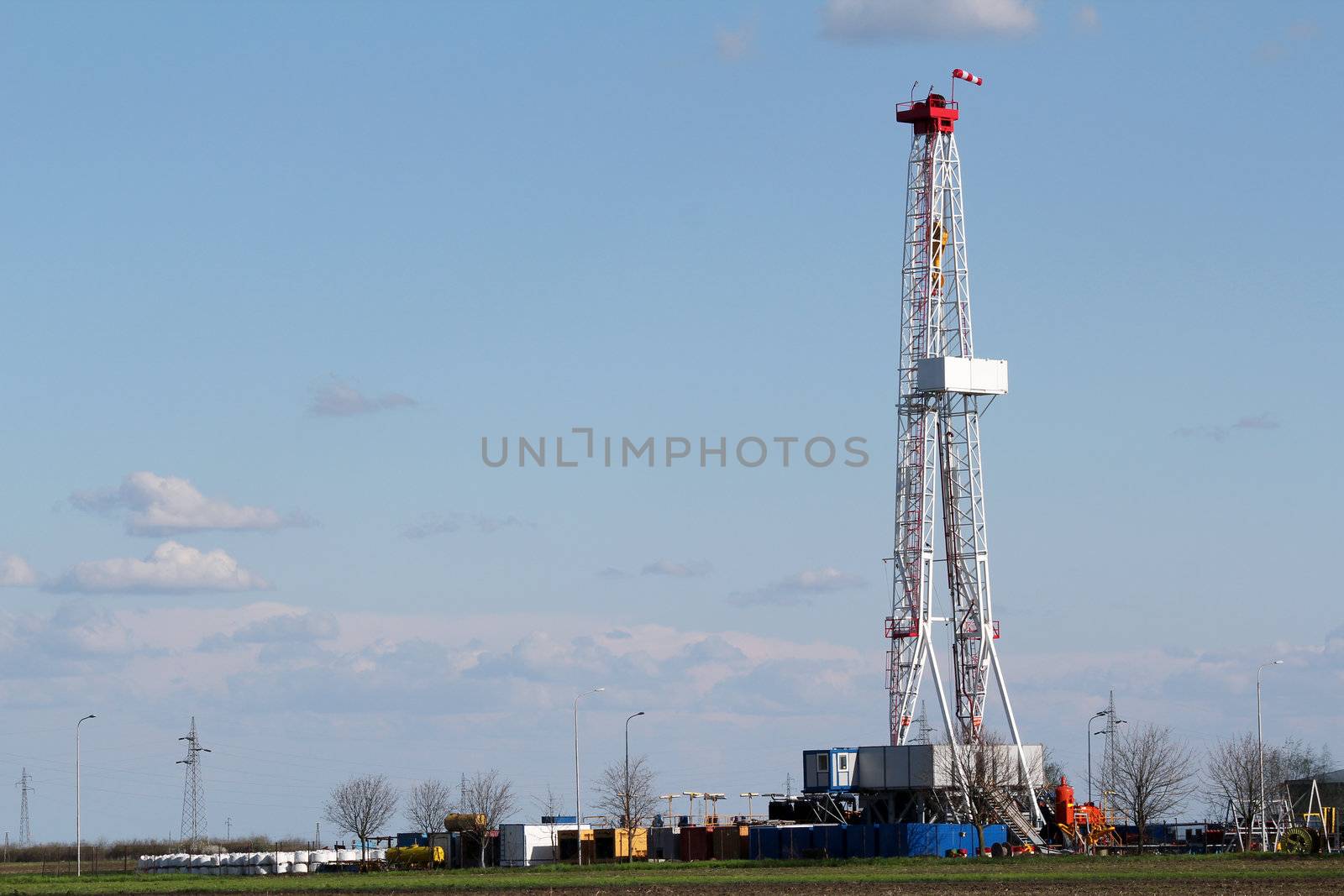 oil drilling rig on field by goce