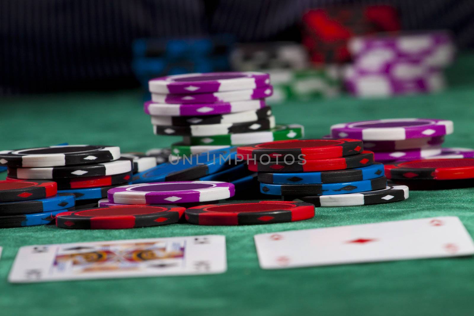 Poker chips and cards in a Texas hold 'em game.