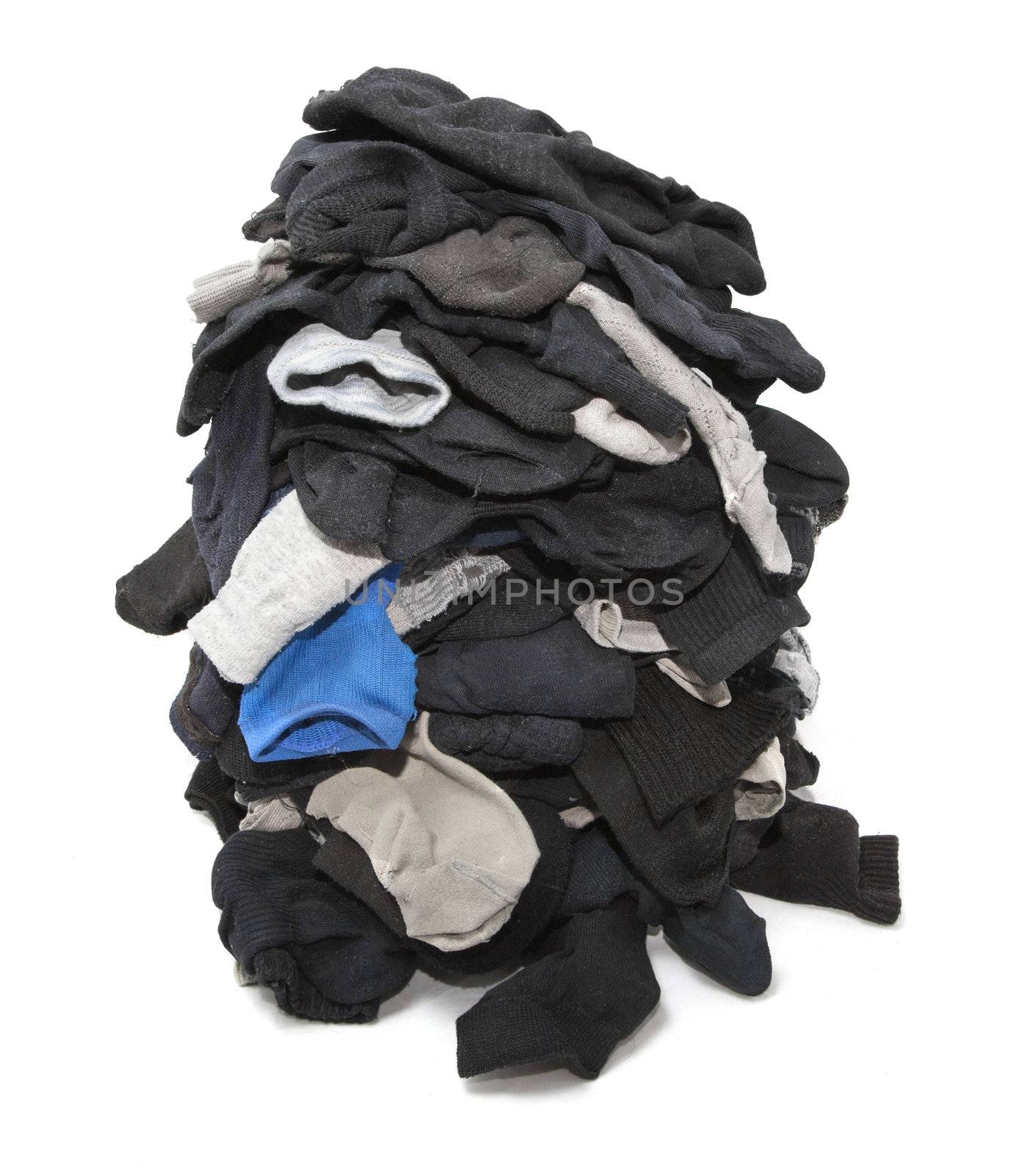 Heap of unsorted socks isolated over white