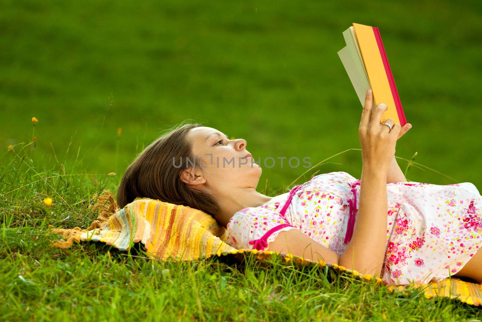 Beautiful woman reading in the park