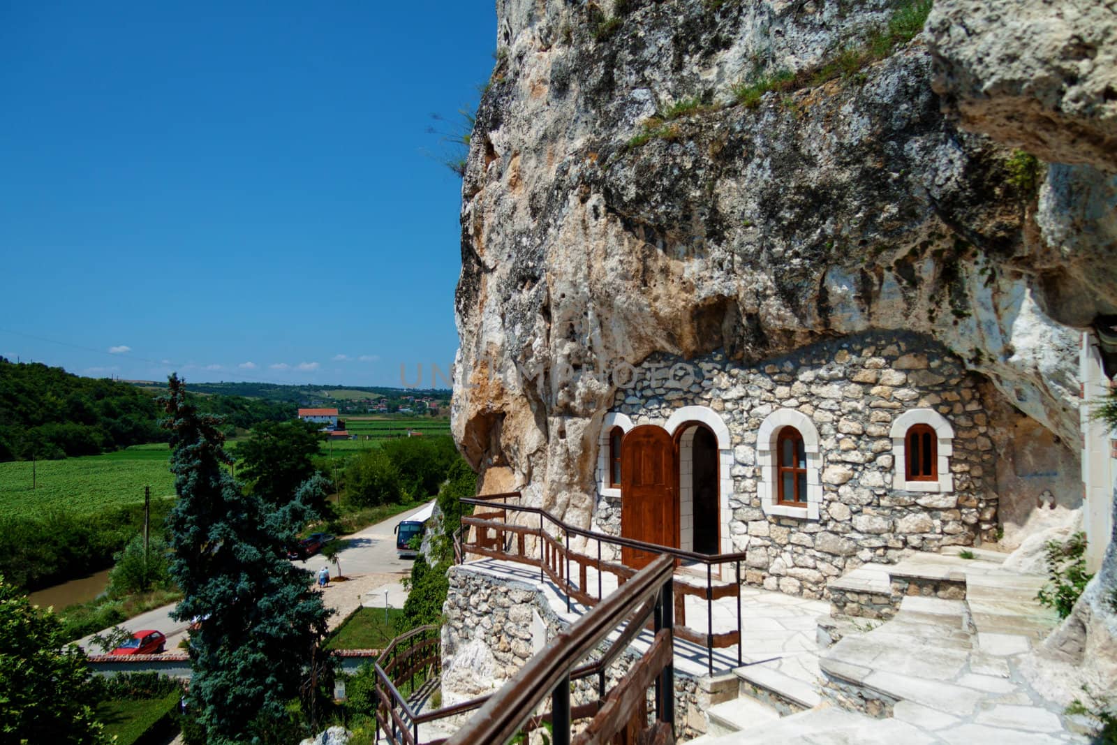 Orthodox monastery excavated in the rocks view from above by Lamarinx
