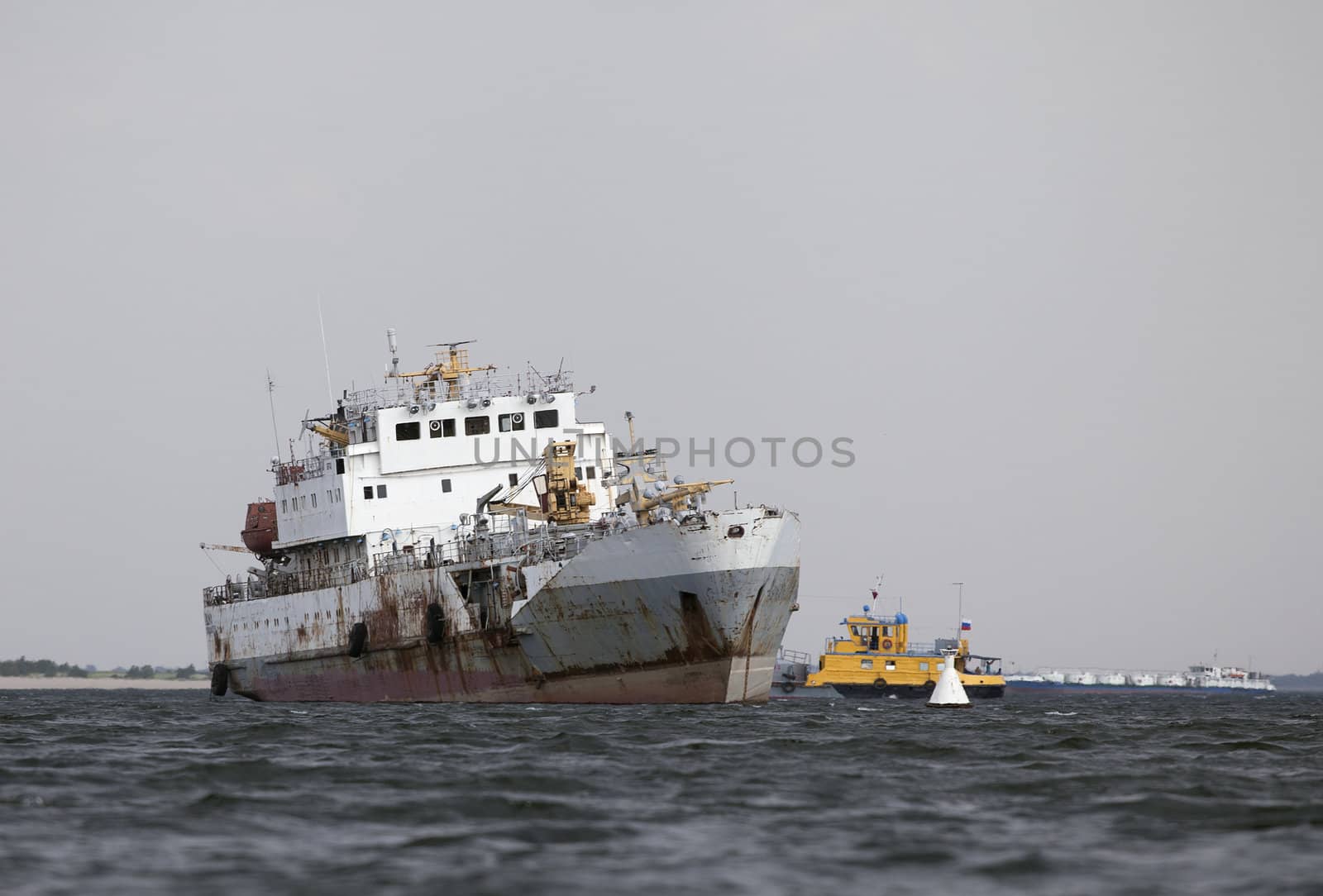 Abandoned ship in the middle of a river