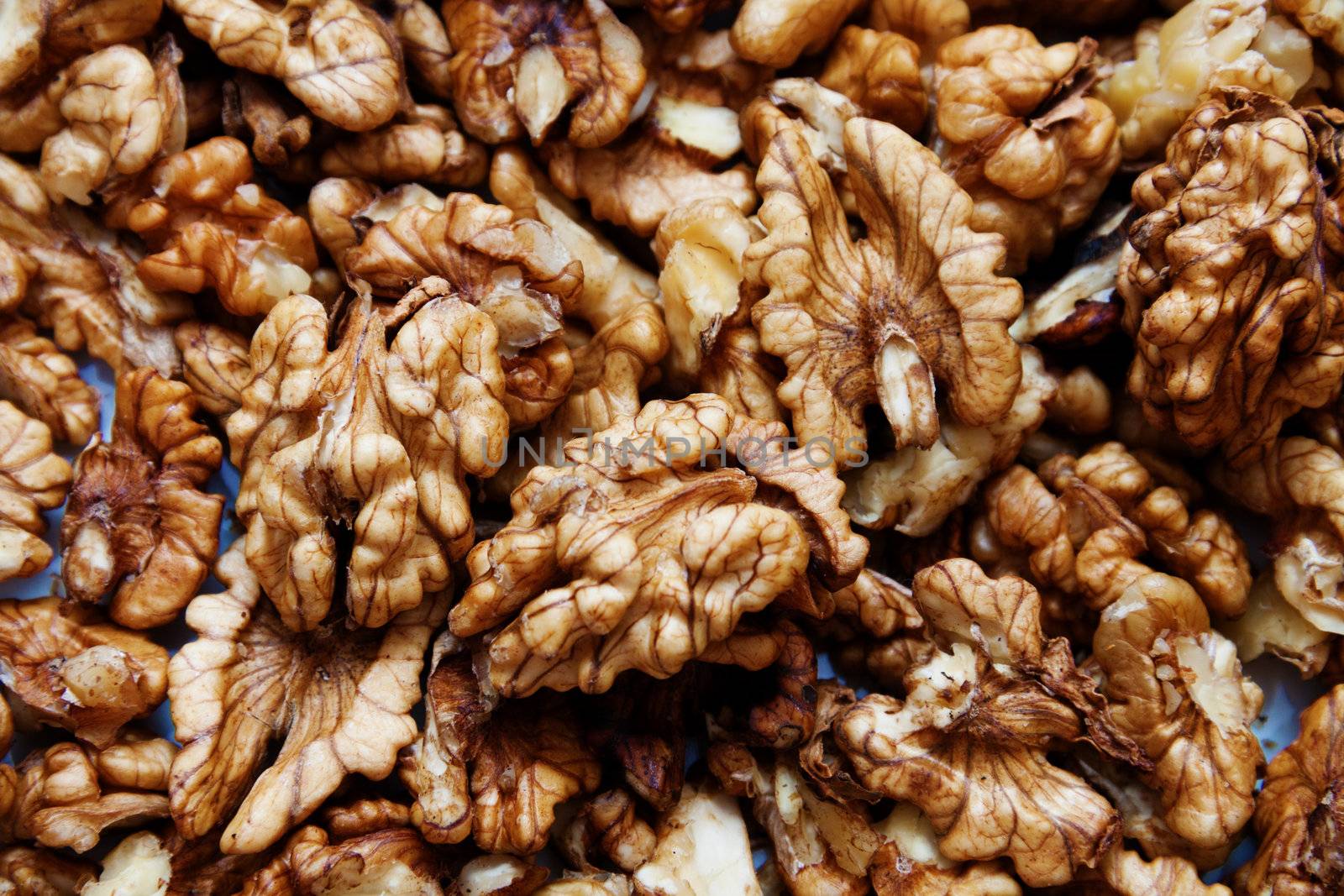 Close up of raw wallnuts, horizontal shot by Lamarinx