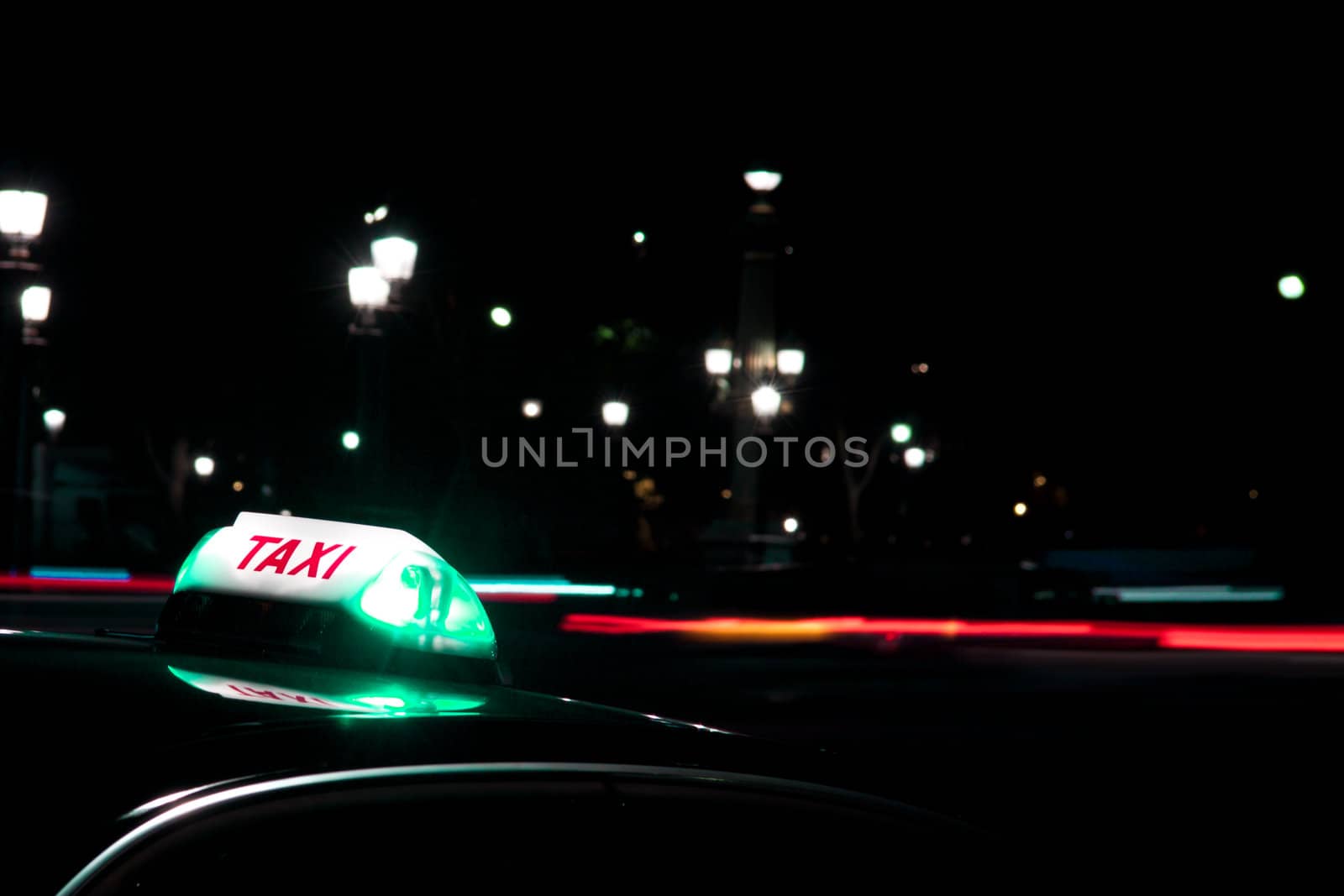 At night it is always safer to get a taxi. Night shot of taxi sign, taken at Place Concorde, Paris.