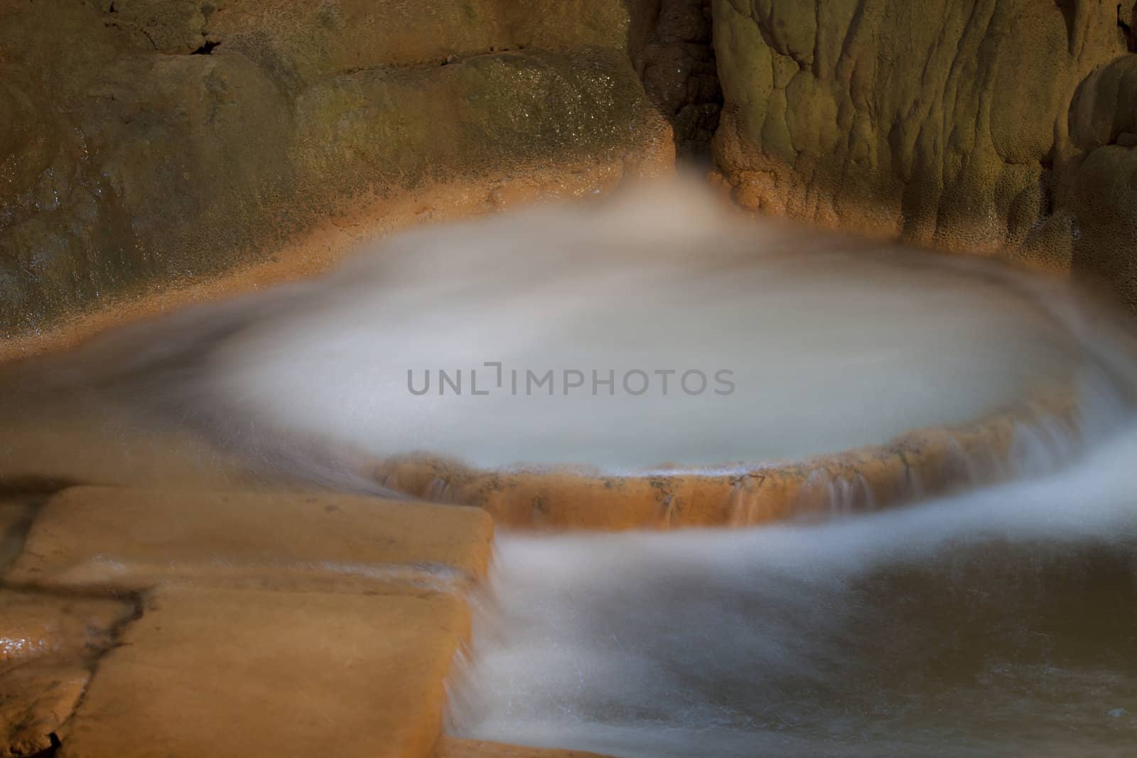 Ancient washing machine with streaming water.