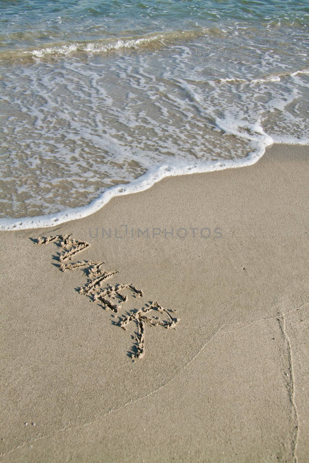 Summer, written on the sand and washed away. Simbolizes the end of the summer.