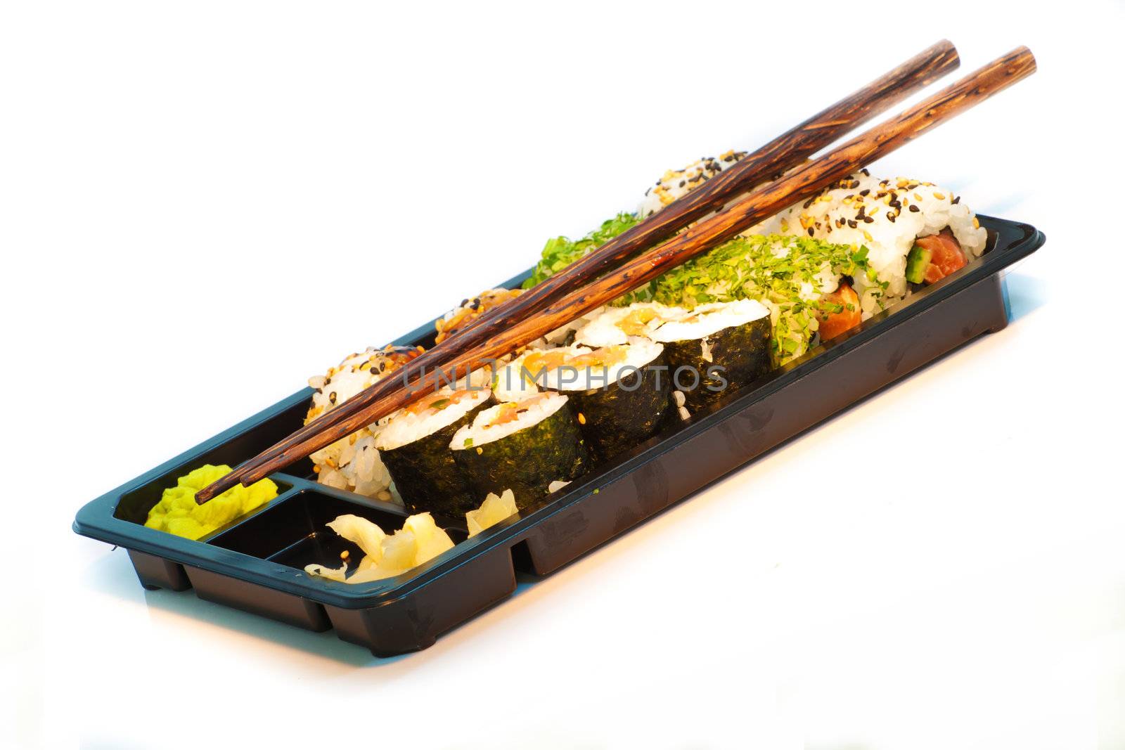 Sushi set with chopsticks in a take away box isolated on white