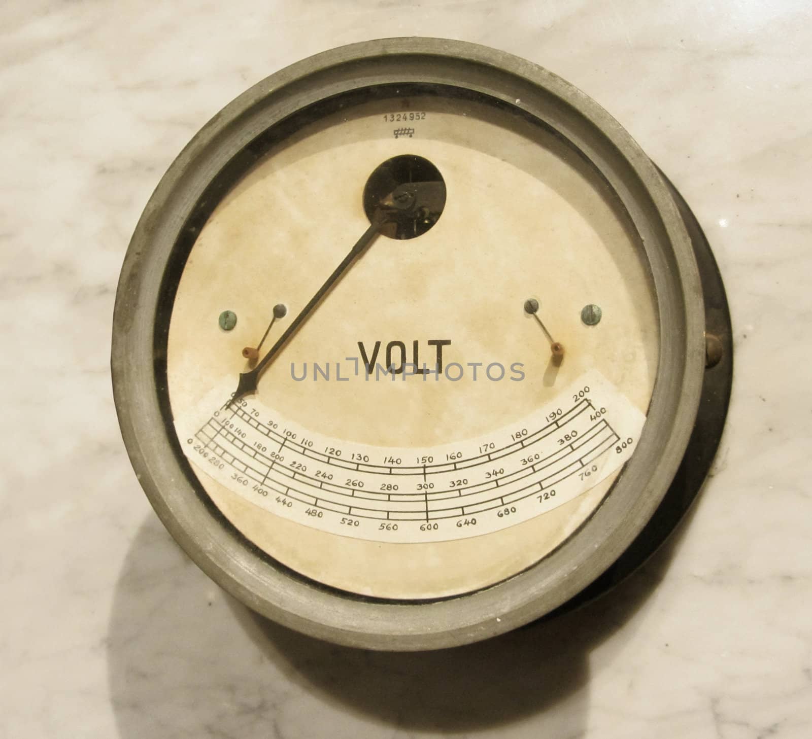 Vintage voltmeter closeup, old electric instrument technology