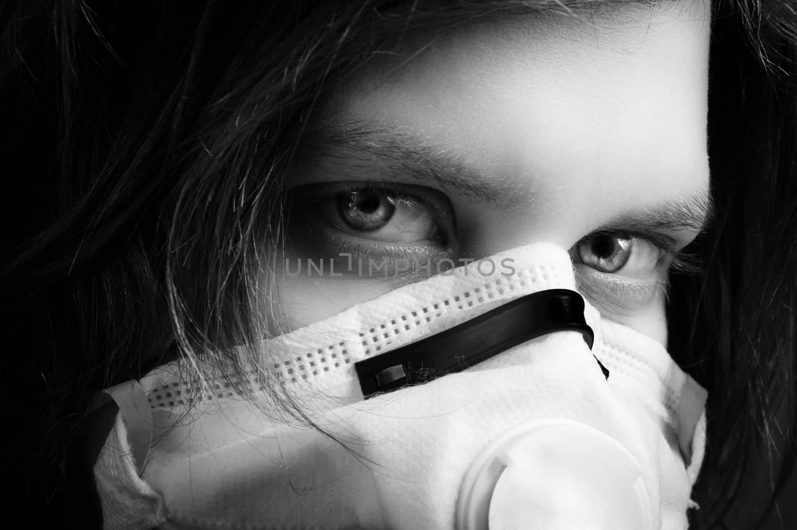 girl wearing protective mask in black and white