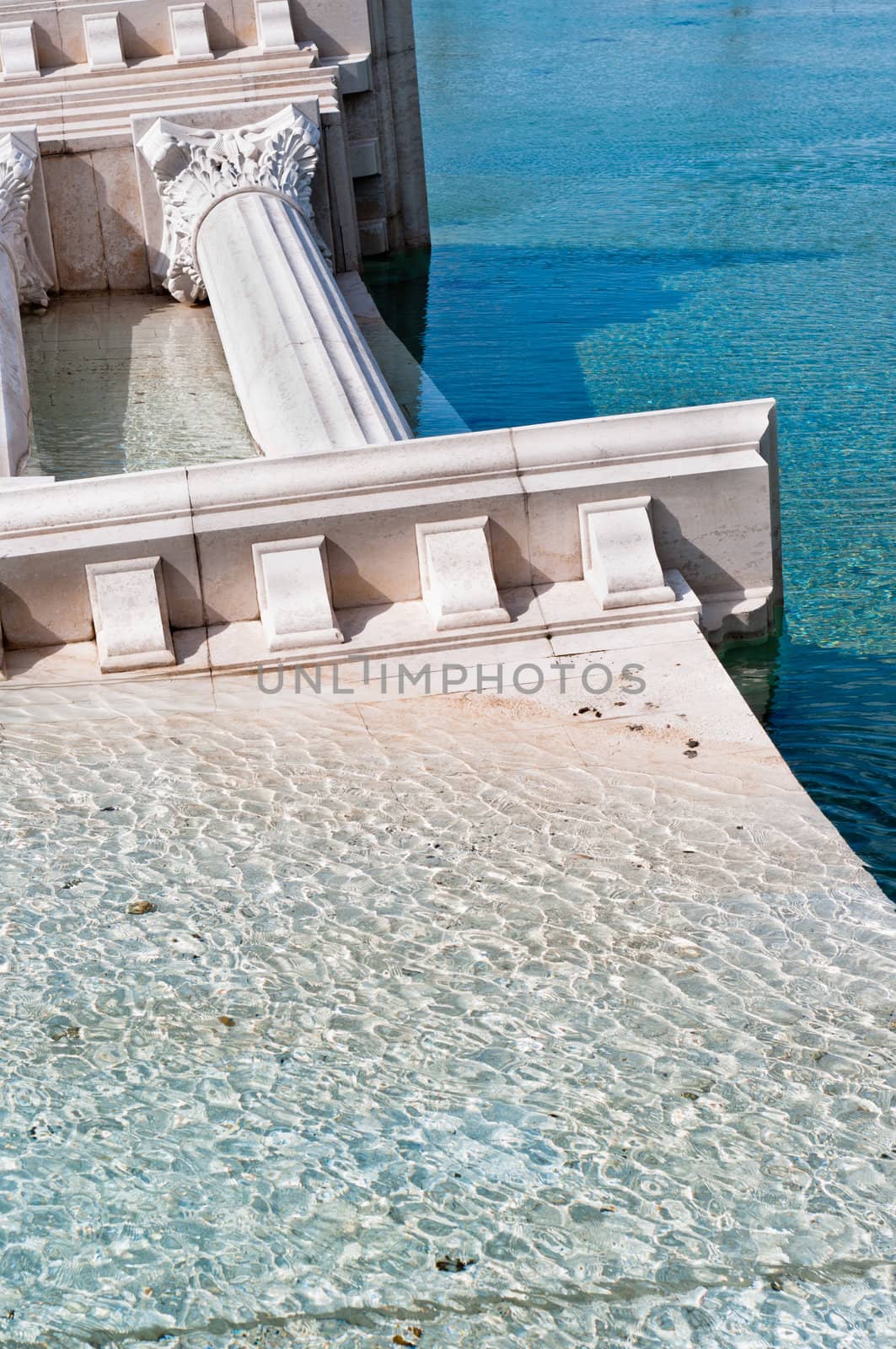 classic roman monument sunk in water