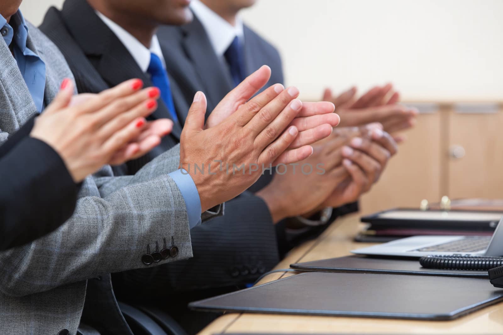 Cropped image of businesspeople clapping