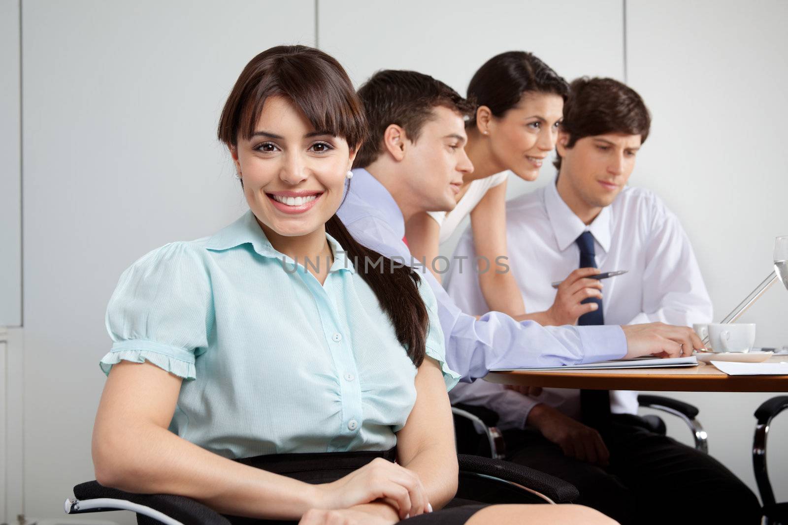 Cute Businesswoman Smiling by leaf