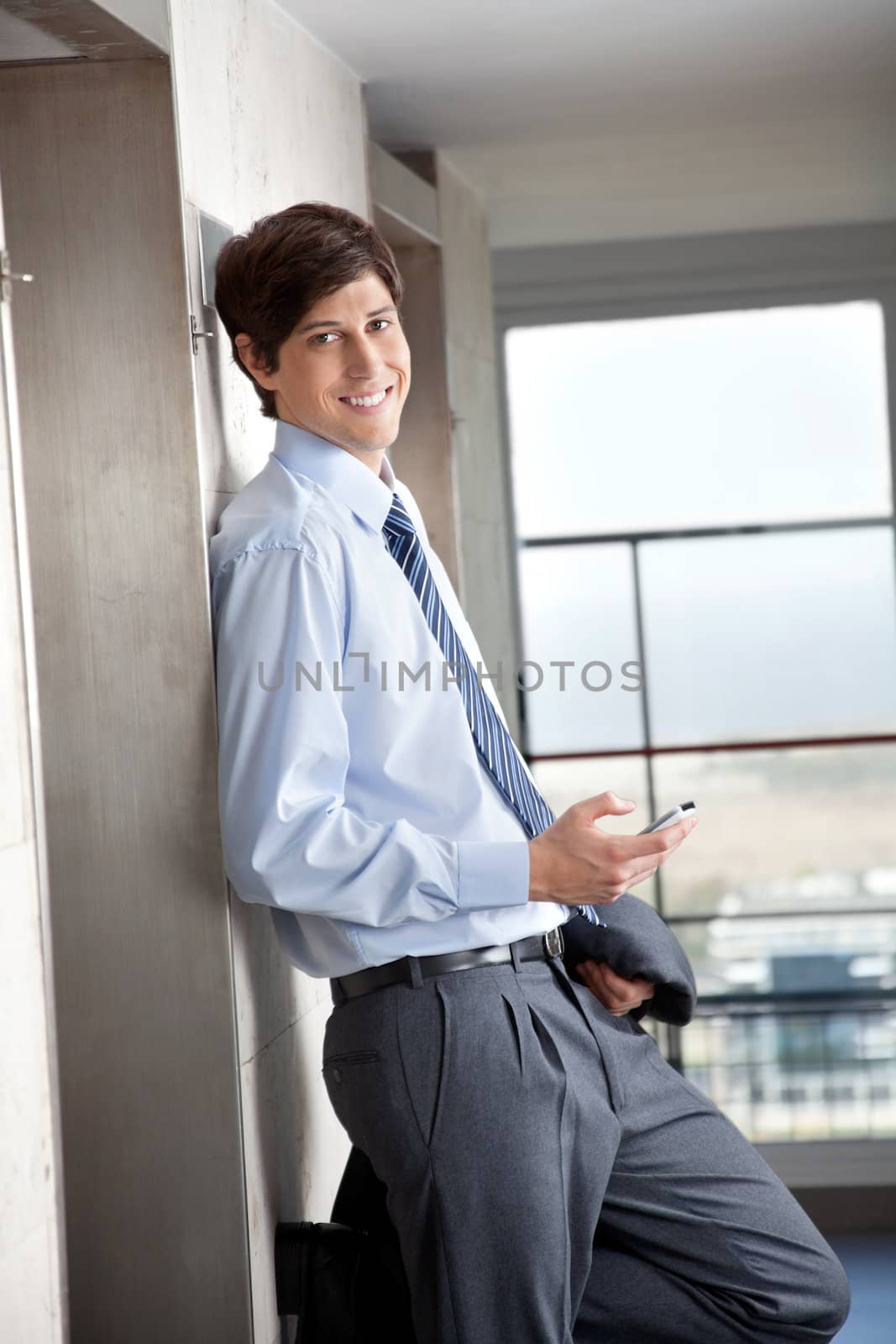 Portrait of smart male business man with cell phone