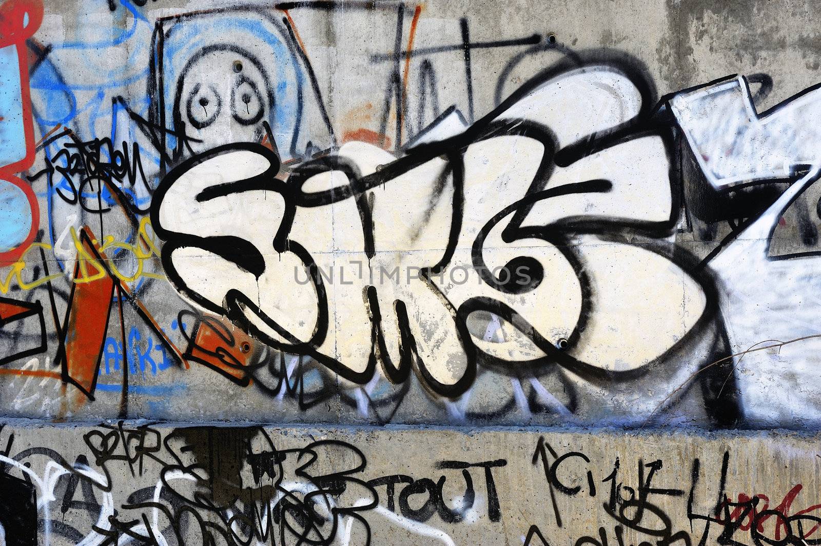 Tags on a cement wall