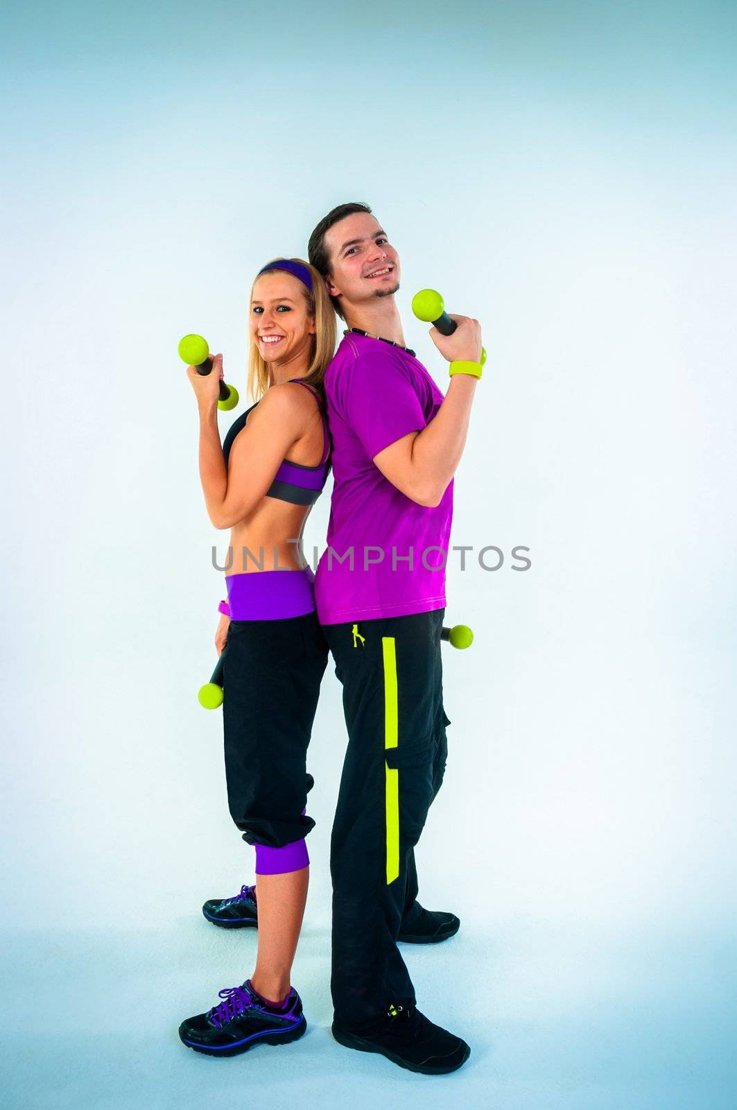 A group of young people training against white background