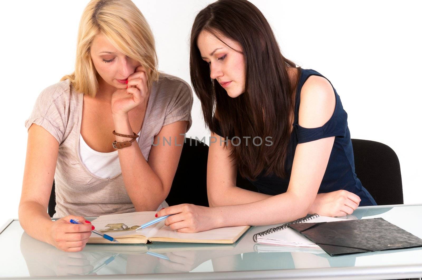 Two beautiful student girls getting ready for school isolated