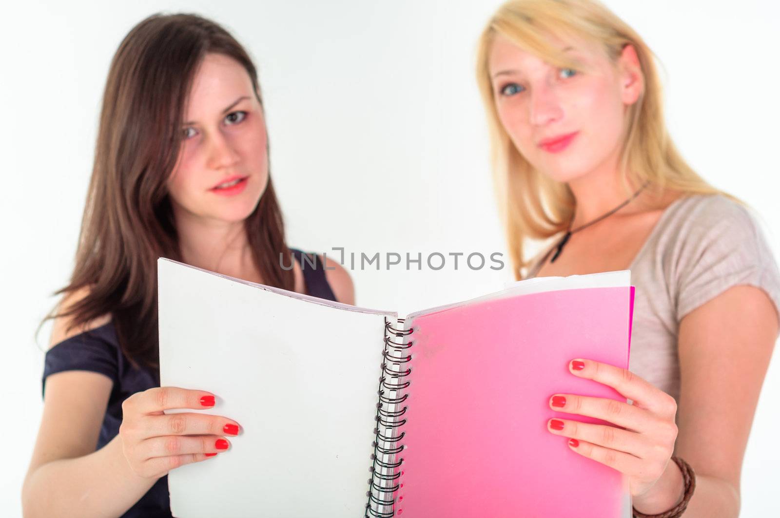 Two beautiful student girls getting ready for school isolated